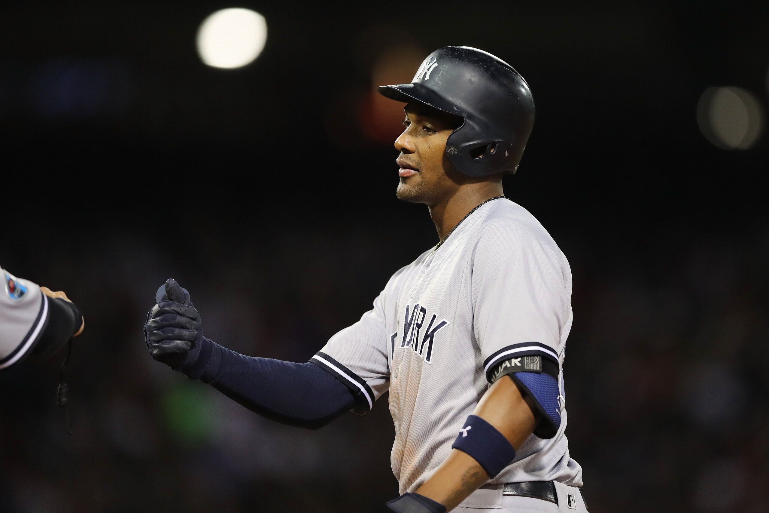 BOSTON, MA - OCTOBER 06:  Miguel Andujar #41 of the New York Yankees celebrates with a fist bump after hitting a single during the sixth inning of Game Two of the American League Division Series against the Boston Red Sox at Fenway Park on October 6, 2018