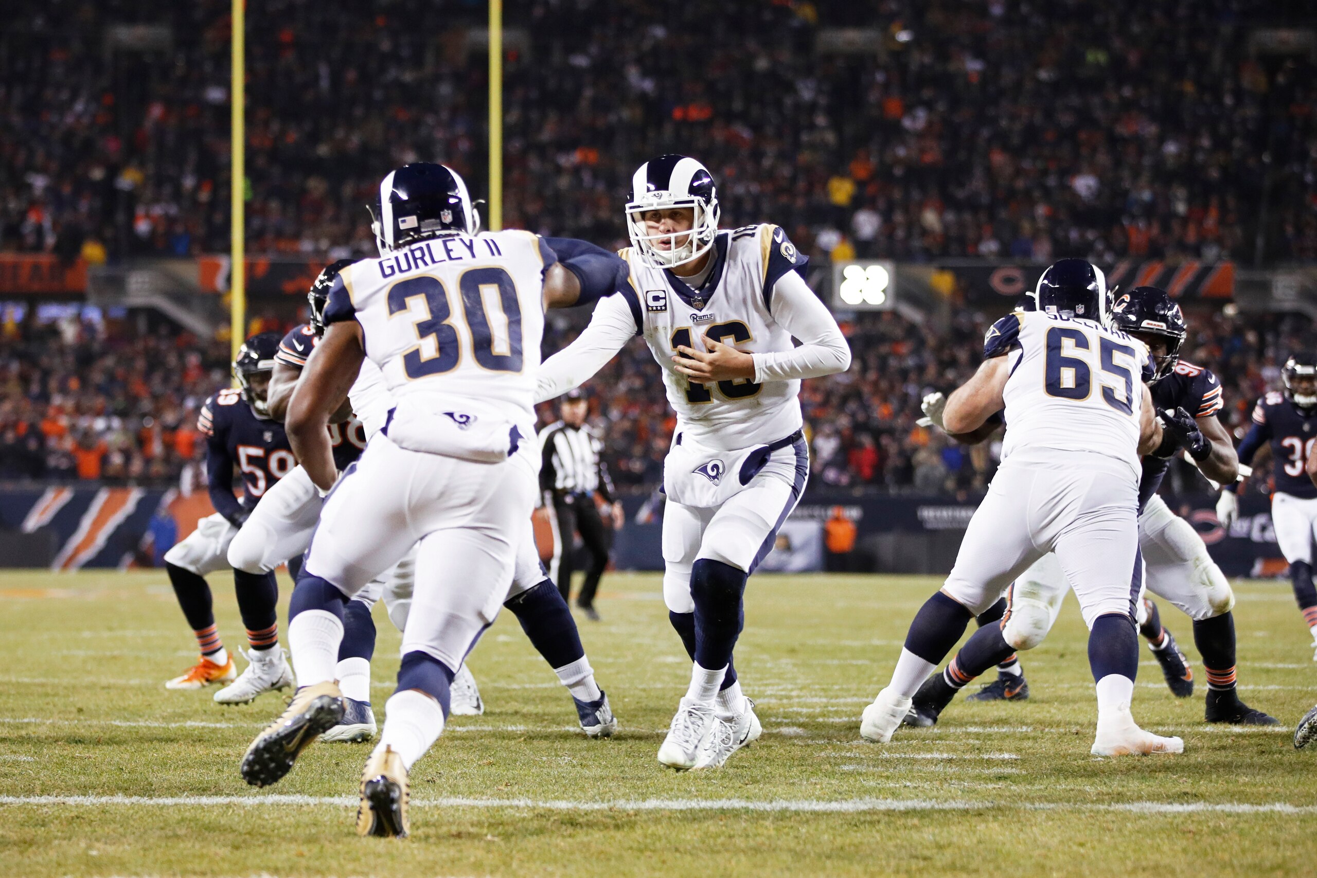 CHICAGO, IL - DECEMBER 09: Jared Goff #16 of the Los Angeles Rams hands off to Todd Gurley II #30 during the game against the Chicago Bears at Soldier Field on December 9, 2018 in Chicago, Illinois. The Bears won 15-6. (Photo by Joe Robbins/Getty Images)