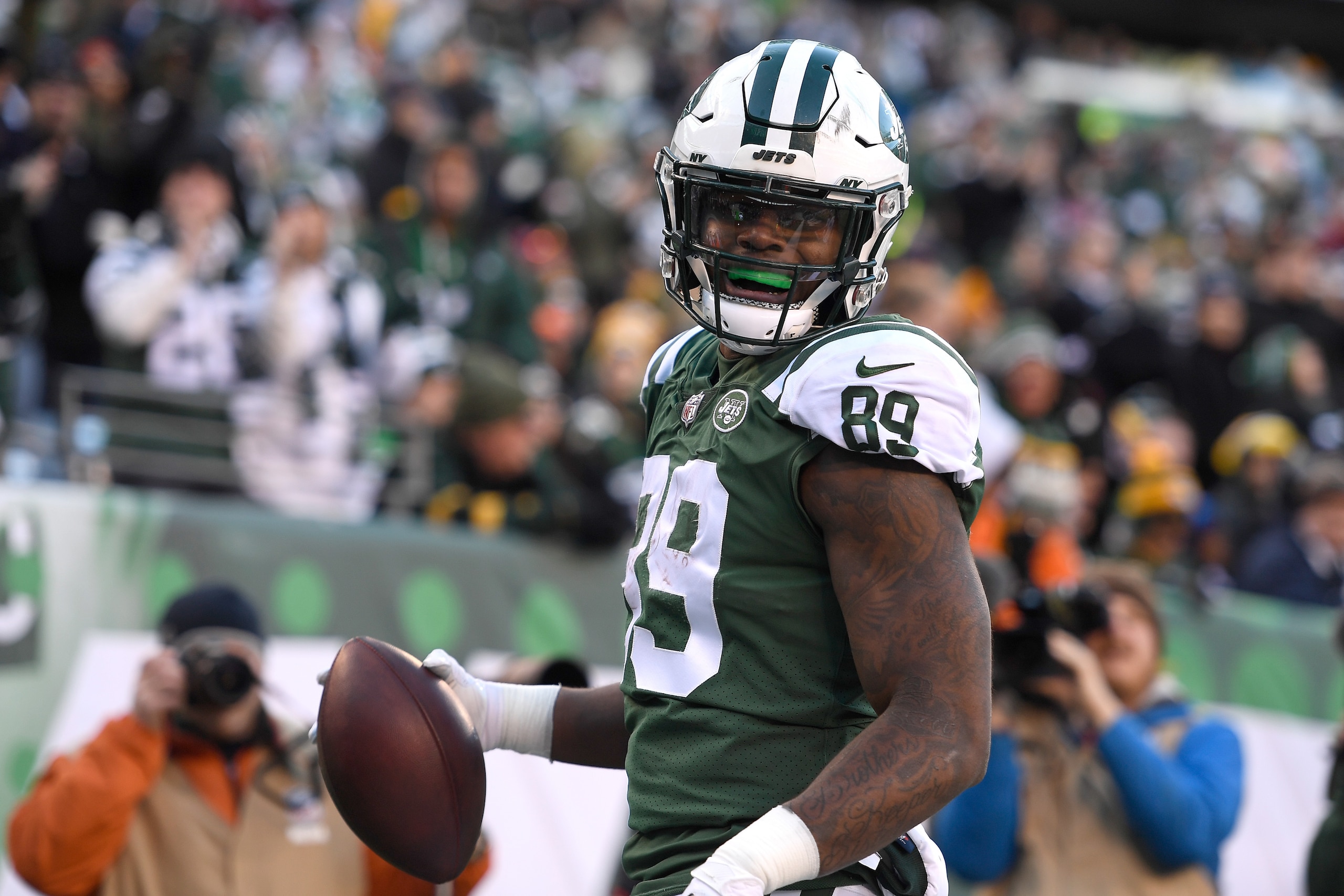 EAST RUTHERFORD, NJ - DECEMBER 23: Chris Herndon #89 of the New York Jets reacts after scoring a toudown against the Green Bay Packers during the third quarter at MetLife Stadium on December 23, 2018 in East Rutherford, New Jersey.  (Photo by Sarah Stier/