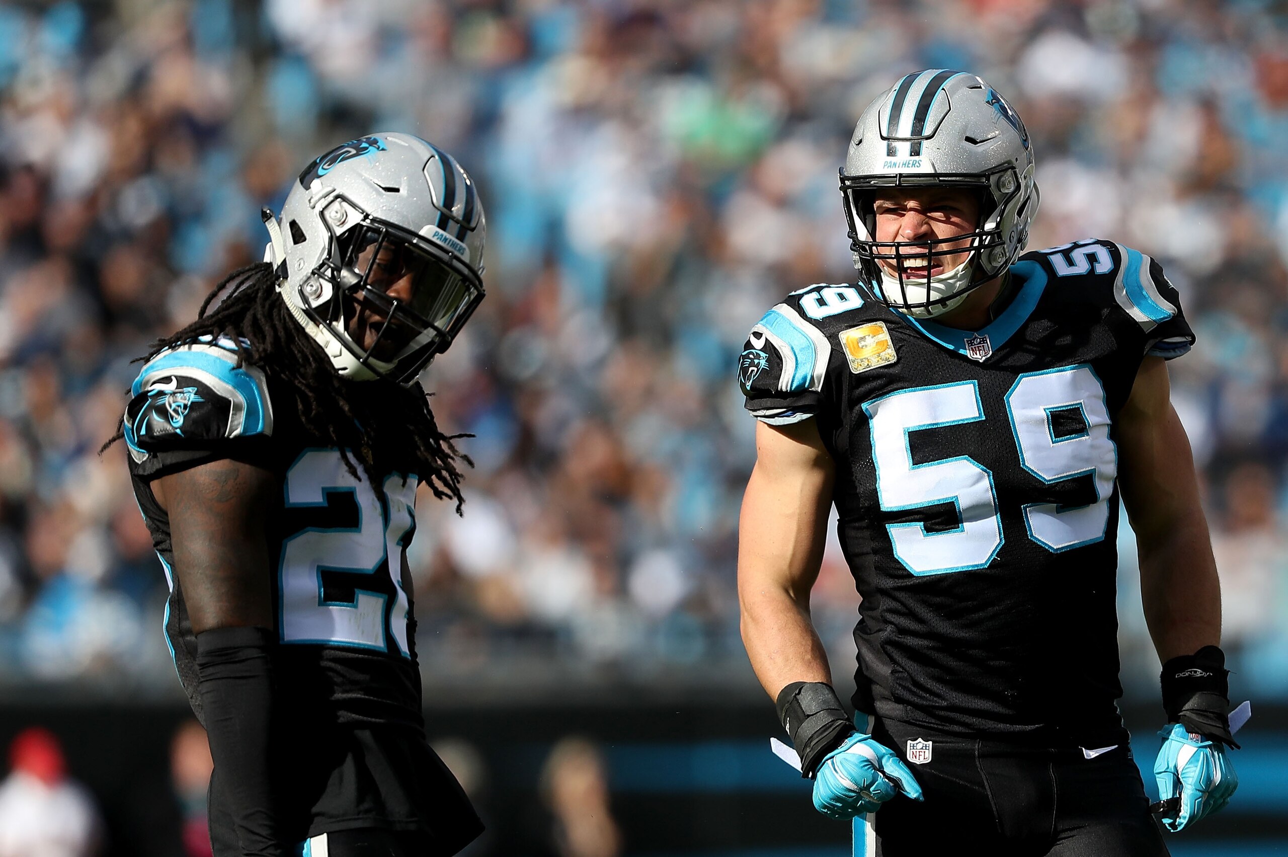 CHARLOTTE, NC - NOVEMBER 04:  Luke Kuechly #59 and teammate Donte Jackson #26 of the Carolina Panthers react against the Tampa Bay Buccaneers in the second quarter during their game at Bank of America Stadium on November 4, 2018 in Charlotte, North Caroli