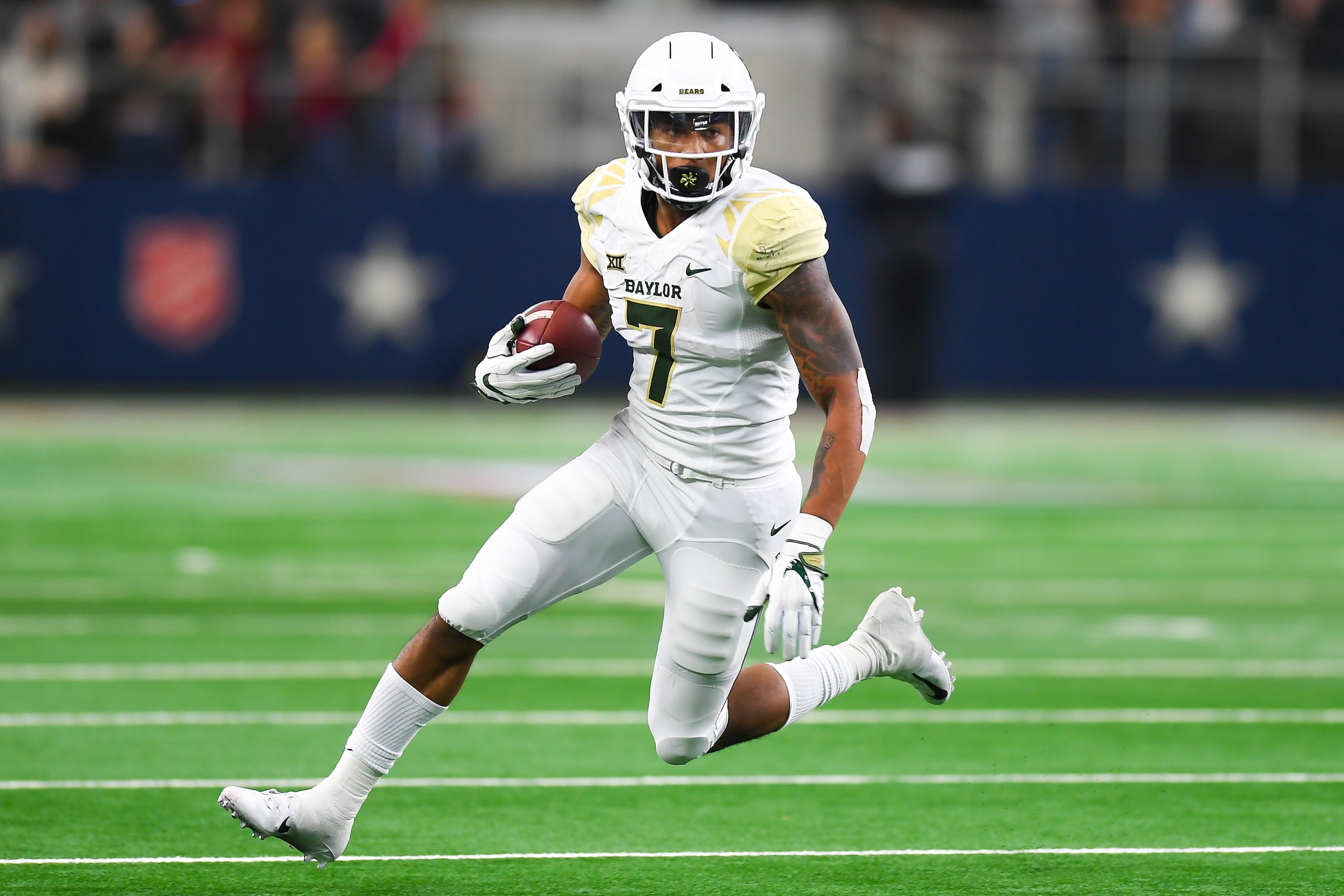 LUBBOCK, TX - NOVEMBER 24: Running back John Lovett #7 of the Baylor Bears carries the ball during the game against the Texas Tech Red Raiders on November 24, 2018 at  AT&T Stadium in Arlington, Texas. Baylor defeated Texas Tech 35-24. (Photo by John Weas
