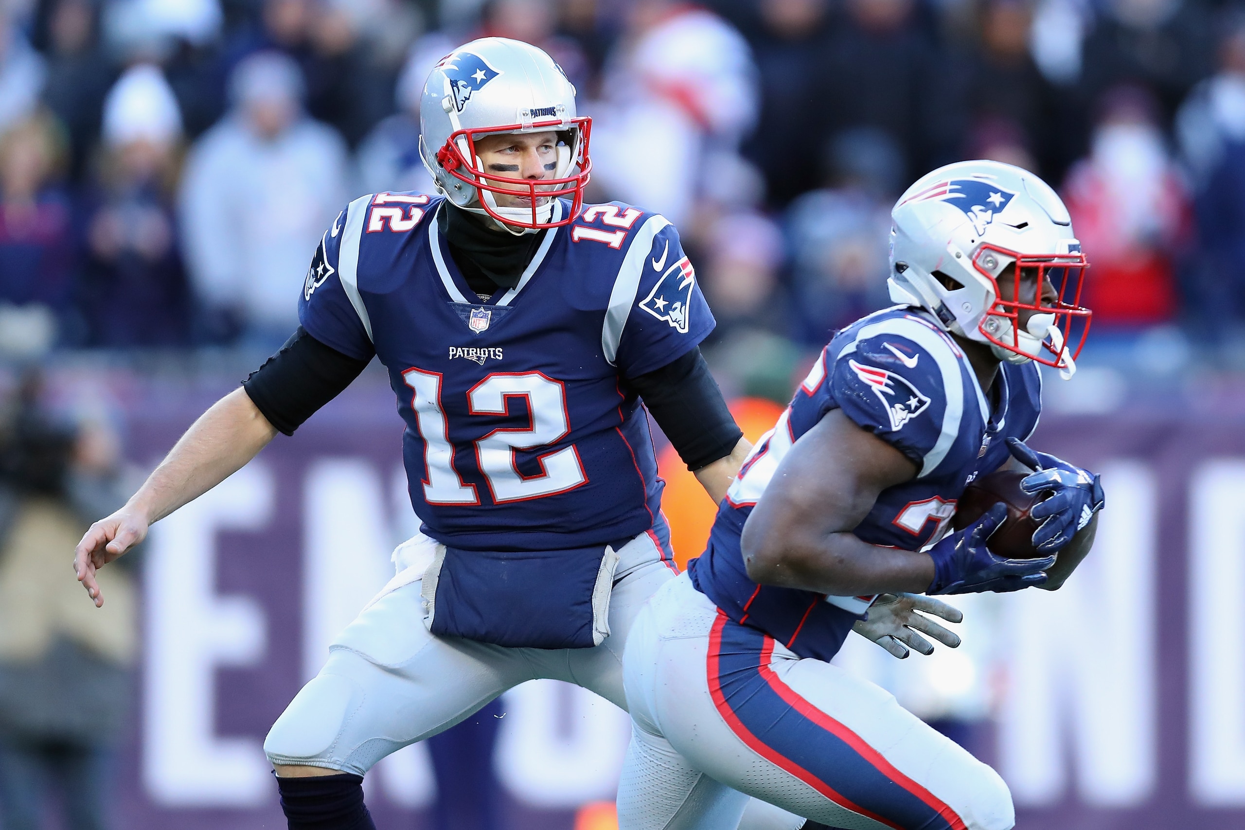 FOXBOROUGH, MA - DECEMBER 23:  Tom Brady #12 of the New England Patriots hands off to Sony Michel #26 during the second half against the Buffalo Bills at Gillette Stadium on December 23, 2018 in Foxborough, Massachusetts.  (Photo by Maddie Meyer/Getty Ima
