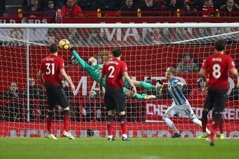 MANCHESTER, ENGLAND - DECEMBER 26:  David De Gea of Manchester United saves a shot during the Premier League match between Manchester United and Huddersfield Town at Old Trafford on December 26, 2018 in Manchester, United Kingdom.  (Photo by Clive Brunski