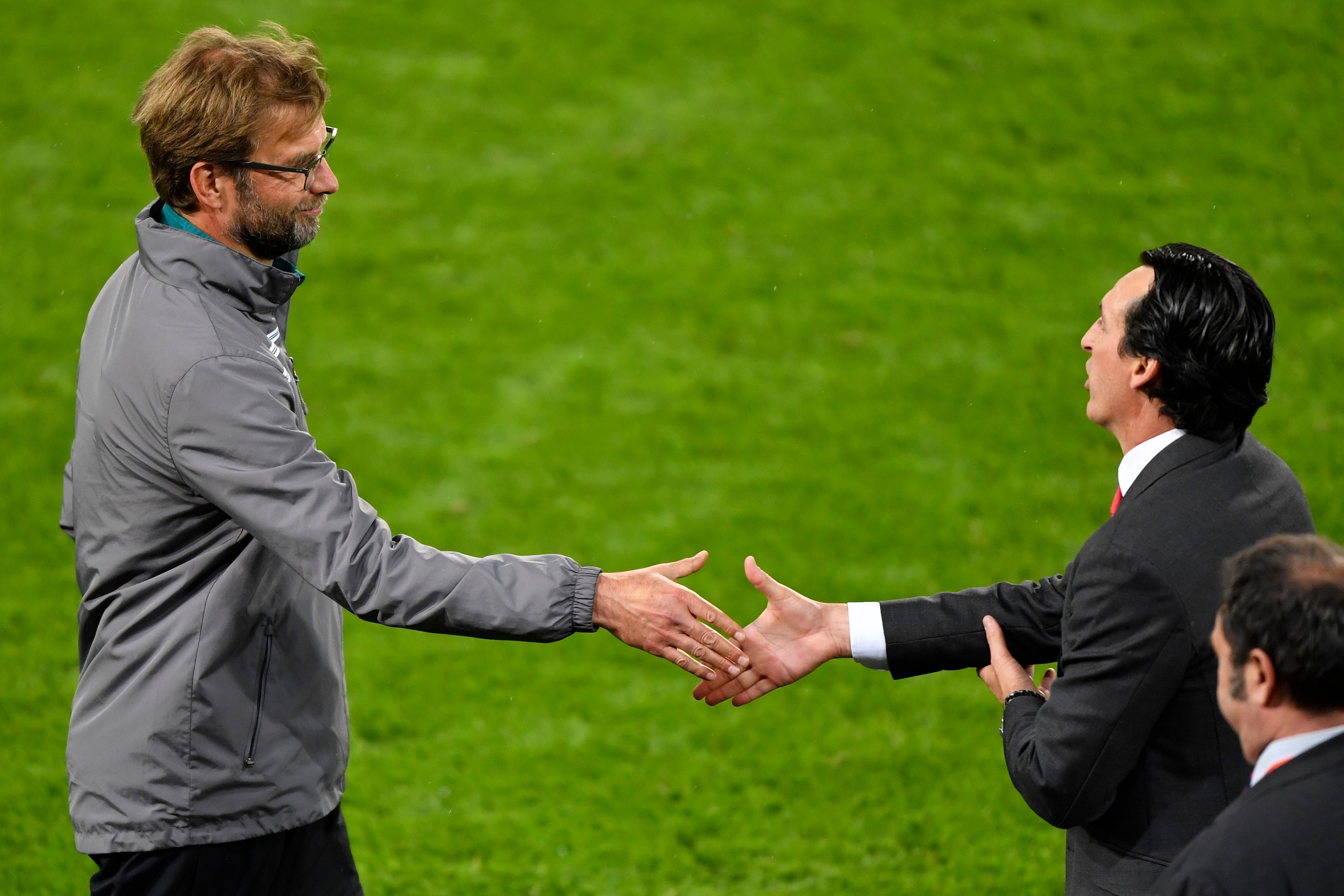 Sevilla's Spanish head coach Unai Emery  (R) shakes hands with Liverpool's German head coach Jurgen Klopp after Sevilla won the  UEFA Europa League final football match between Liverpool FC and Sevilla FC at the St Jakob-Park stadium in Basel, on May 18, 