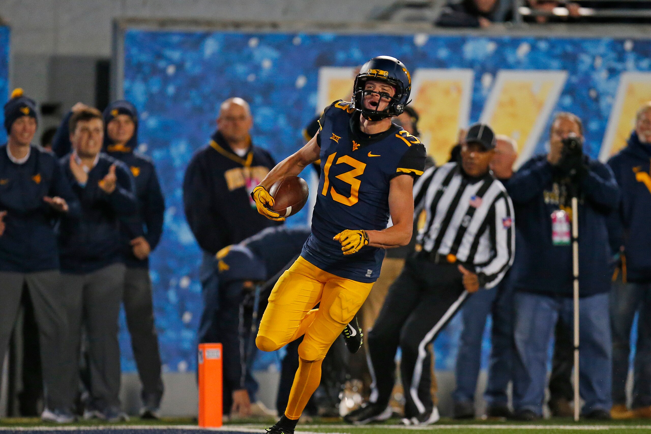 MORGANTOWN, WV - OCTOBER 25: David Sills V #13 of the West Virginia Mountaineers celebrates after catching a 65 yard touchdown pass in the first half against the Baylor Bears at Mountaineer Field on October 25, 2018 in Morgantown, West Virginia. (Photo MORGANTOWN, WV - OCTOBER 25: David Sills V #13 of the West Virginia Mountaineers celebrates after catching a 65 yard touchdown pass in the first half against the Baylor Bears at Mountaineer Field on October 25, 2018 in Morgantown, West Virginia. (Photo