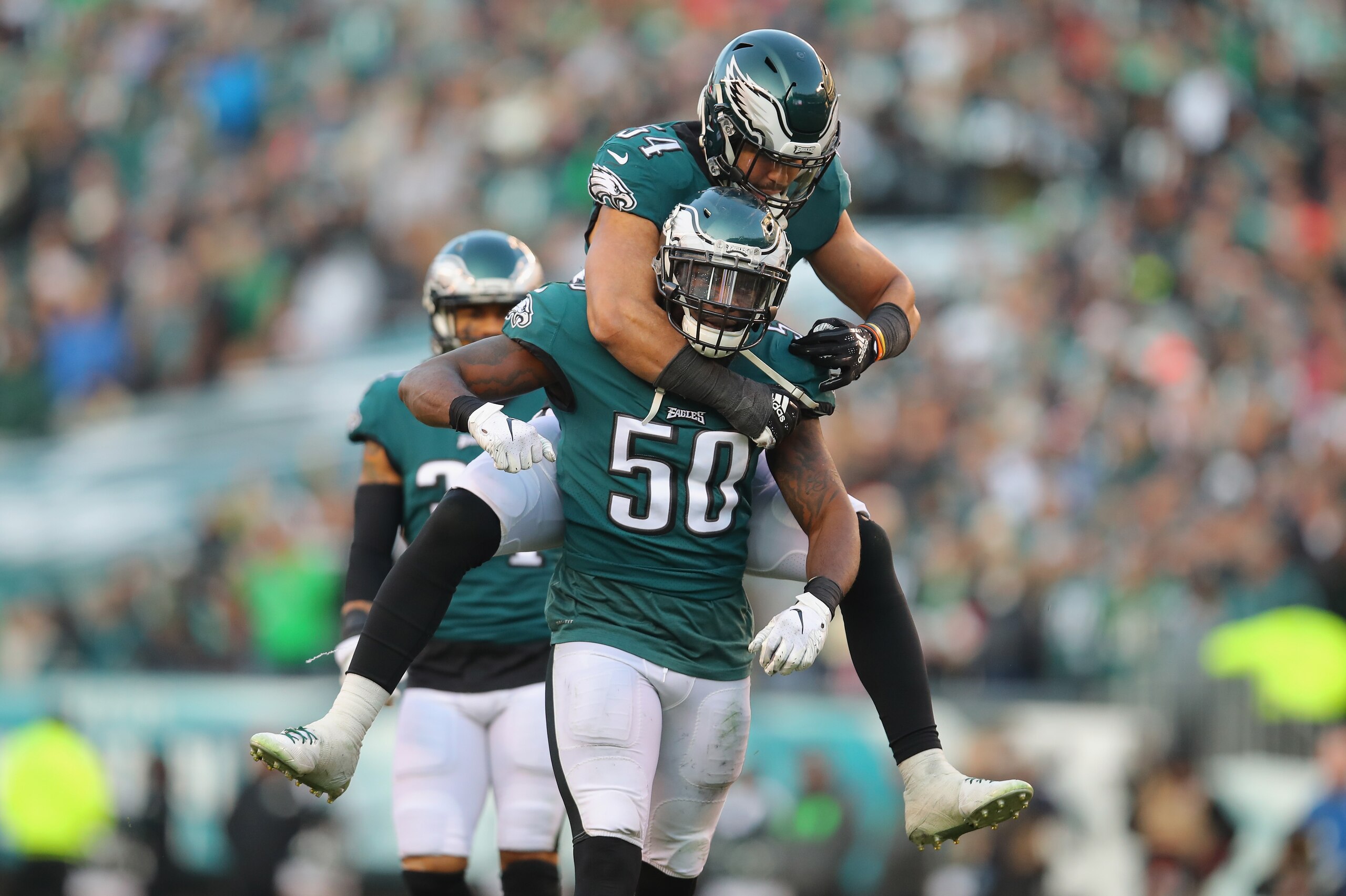 PHILADELPHIA, PA - DECEMBER 23:  Linebacker LaRoy Reynolds #50 of the Philadelphia Eagles celebrates with outside linebacker Kamu Grugier-Hill #54 after Reynolds made a tackle on a kickoff against the Houston Texans during the fourth quarter at Lincoln Fi