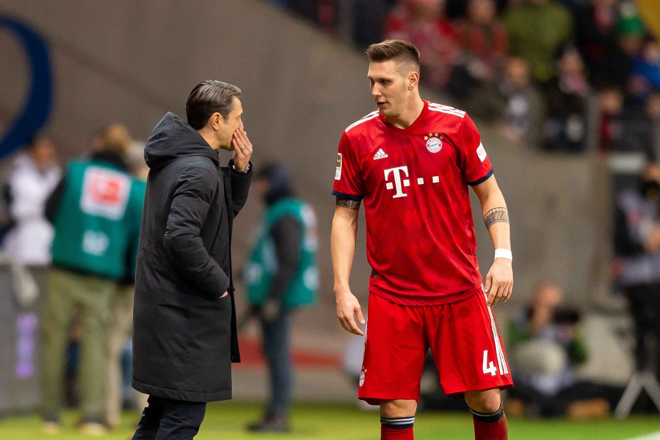 FRANKFURT AM MAIN, GERMANY - DECEMBER 22: Head coach Niko Kovac of Bayern Muenchen speak with Niklas Suele of Bayern Muenchen during the Bundesliga match between Eintracht Frankfurt and FC Bayern Muenchen at Commerzbank-Arena on December 22, 2018 in Frank FRANKFURT AM MAIN, GERMANY - DECEMBER 22: Head coach Niko Kovac of Bayern Muenchen speak with Niklas Suele of Bayern Muenchen during the Bundesliga match between Eintracht Frankfurt and FC Bayern Muenchen at Commerzbank-Arena on December 22, 2018 in Frank