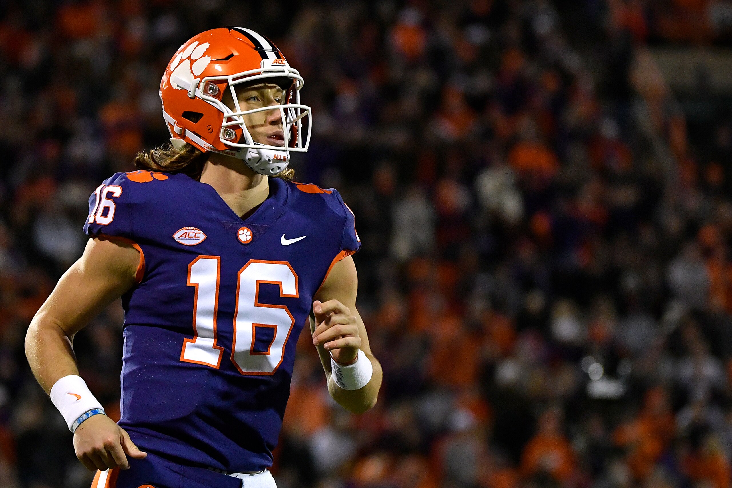 CLEMSON, SOUTH CAROLINA - NOVEMBER 17: Quarterback Trevor Lawrence #16 of the Clemson Tigers runs to the sideline during their football game against the Duke Blue Devils at Clemson Memorial Stadium on November 17, 2018 in Clemson, South Carolina. (Photo b CLEMSON, SOUTH CAROLINA - NOVEMBER 17: Quarterback Trevor Lawrence #16 of the Clemson Tigers runs to the sideline during their football game against the Duke Blue Devils at Clemson Memorial Stadium on November 17, 2018 in Clemson, South Carolina. (Photo b