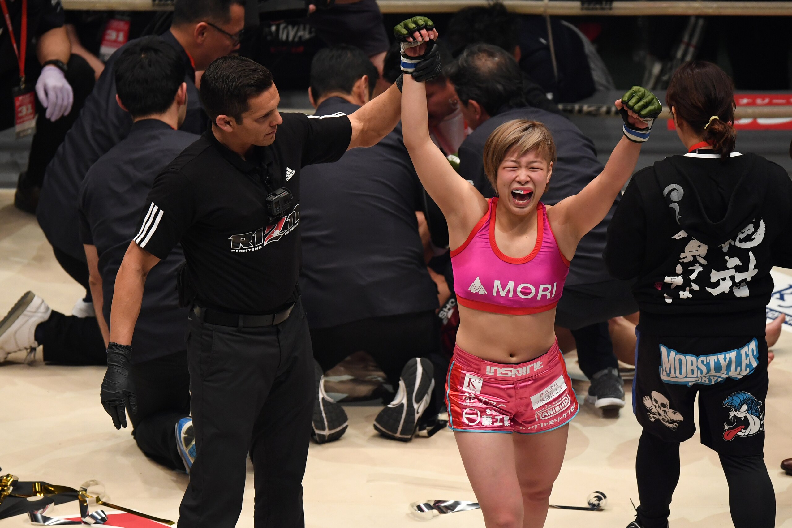SAITAMA, JAPAN - DECEMBER 31:  Kanna Asakura of Japan celebrates her submission victory against RENA of Japan in the women's super atom weight GP final bout during the RIZIN Fighting World Grand-Prix 2017 final Round at Saitama Super Arena on December 31,