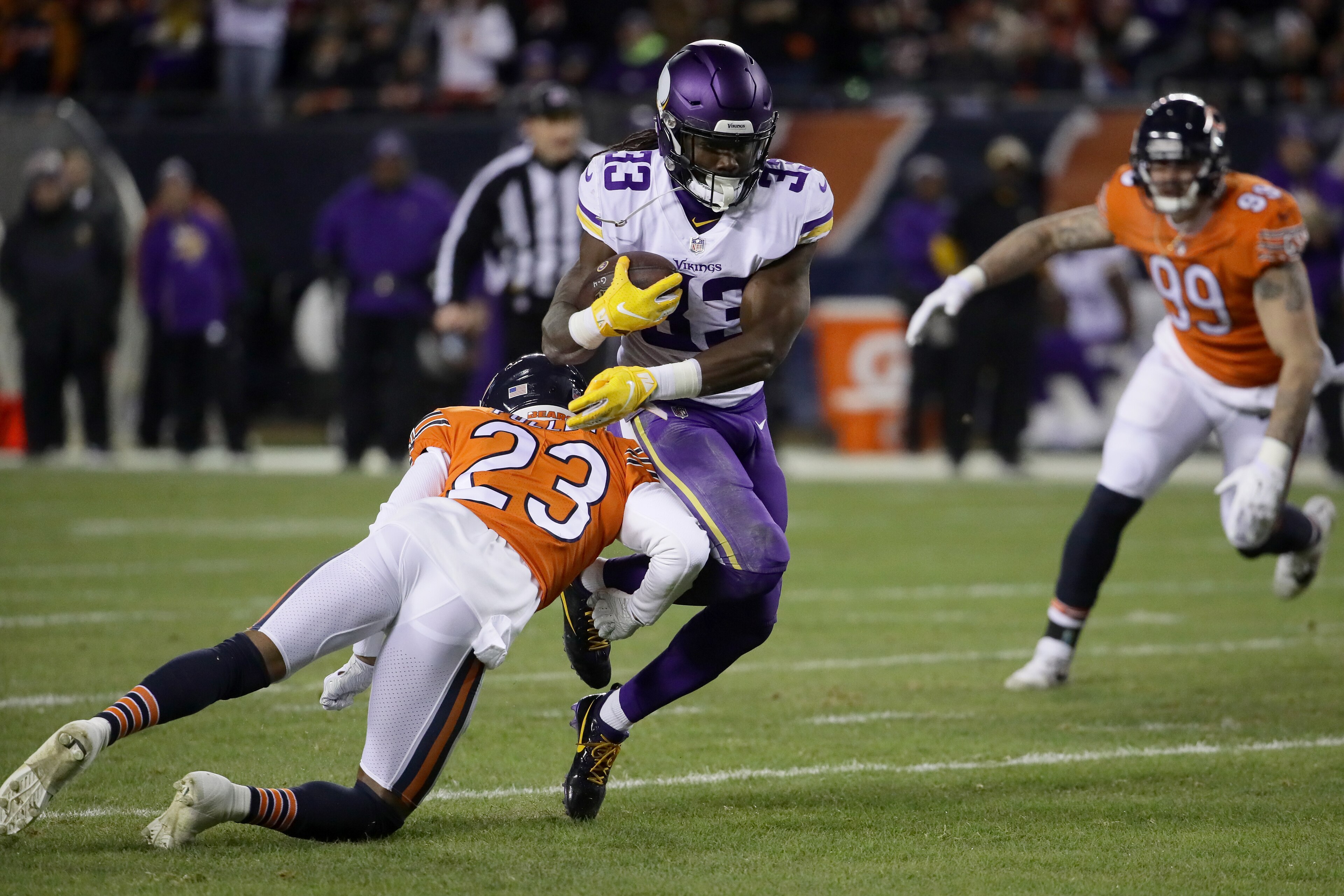 CHICAGO, IL - NOVEMBER 18:  Dalvin Cook #33 of the Minnesota Vikings is hit by Kyle Fuller #23 of the Chicago Bears in the first quarter at Soldier Field on November 18, 2018 in Chicago, Illinois.  (Photo by Jonathan Daniel/Getty Images)