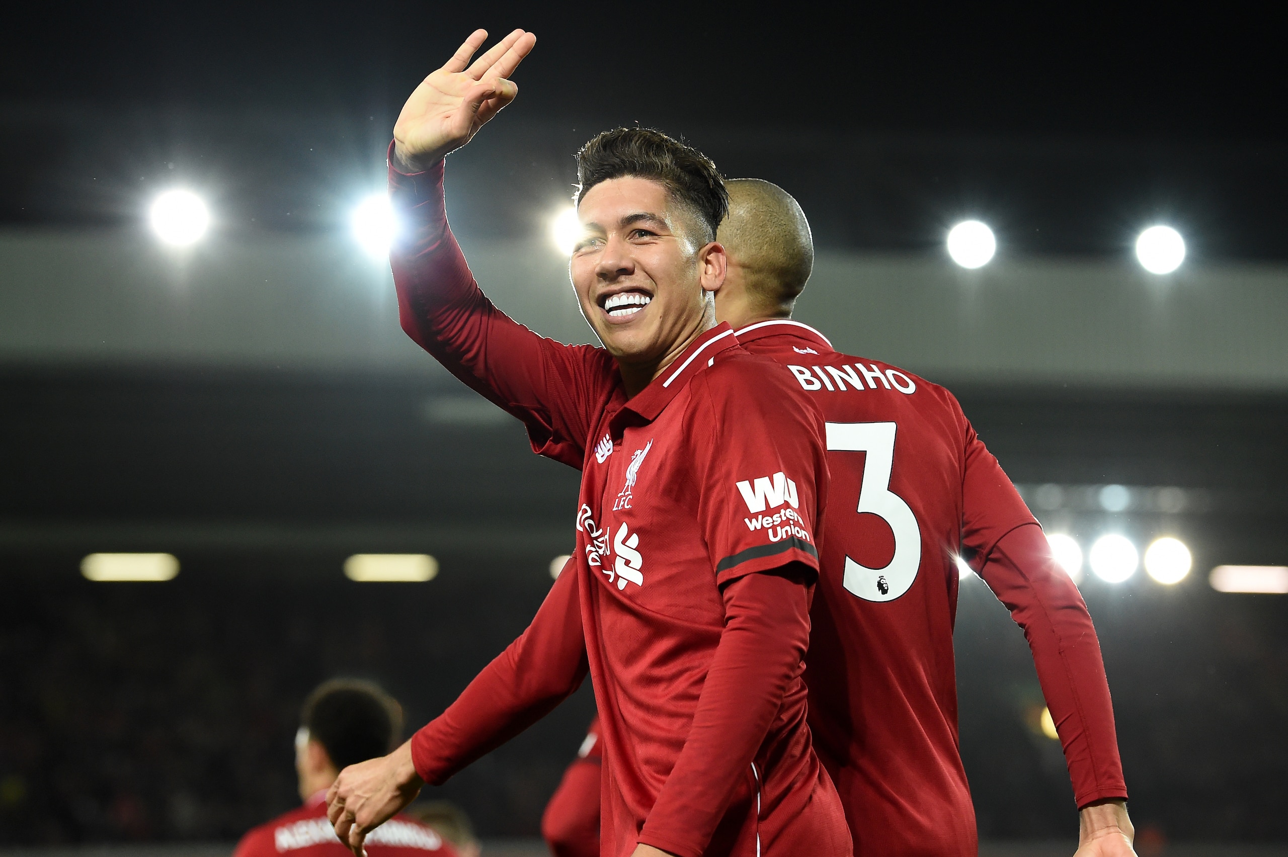Liverpool's Brazilian midfielder Roberto Firmino celebrates shooting from the penalty spot to score his team's fifth goal during the English Premier League football match between Liverpool and Arsenal at Anfield in Liverpool, north west England on Decembe Liverpool's Brazilian midfielder Roberto Firmino celebrates shooting from the penalty spot to score his team's fifth goal during the English Premier League football match between Liverpool and Arsenal at Anfield in Liverpool, north west England on Decembe