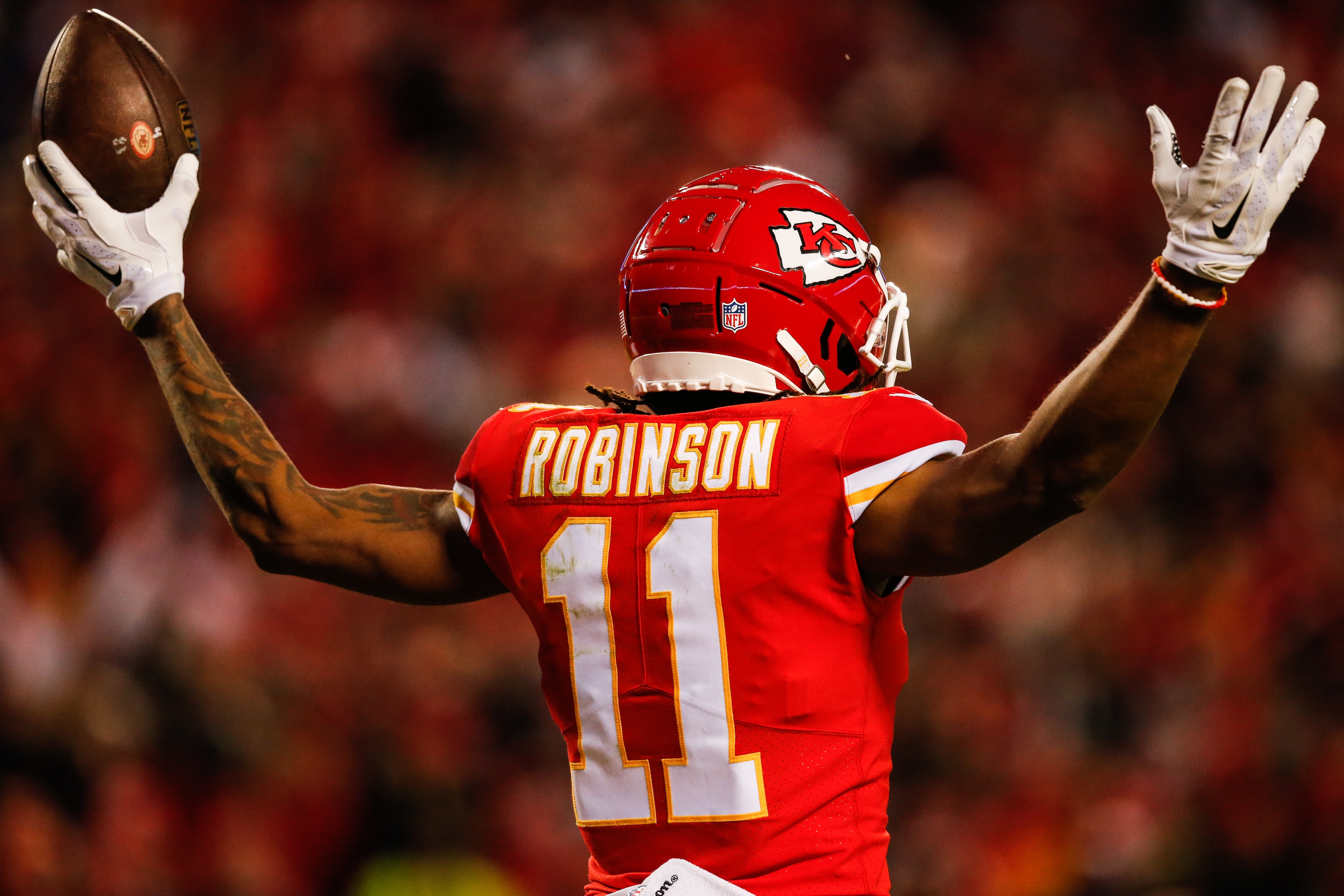 KANSAS CITY, MO - DECEMBER 30:Demarcus Robinson #11 of the Kansas City Chiefs puts his arms up after catching the fiftieth touchdown pass of the season for his quarterback Patrick Mahomes #15 during the third quarter of the game against the Oakland Raider KANSAS CITY, MO - DECEMBER 30:Demarcus Robinson #11 of the Kansas City Chiefs puts his arms up after catching the fiftieth touchdown pass of the season for his quarterback Patrick Mahomes #15 during the third quarter of the game against the Oakland Raider