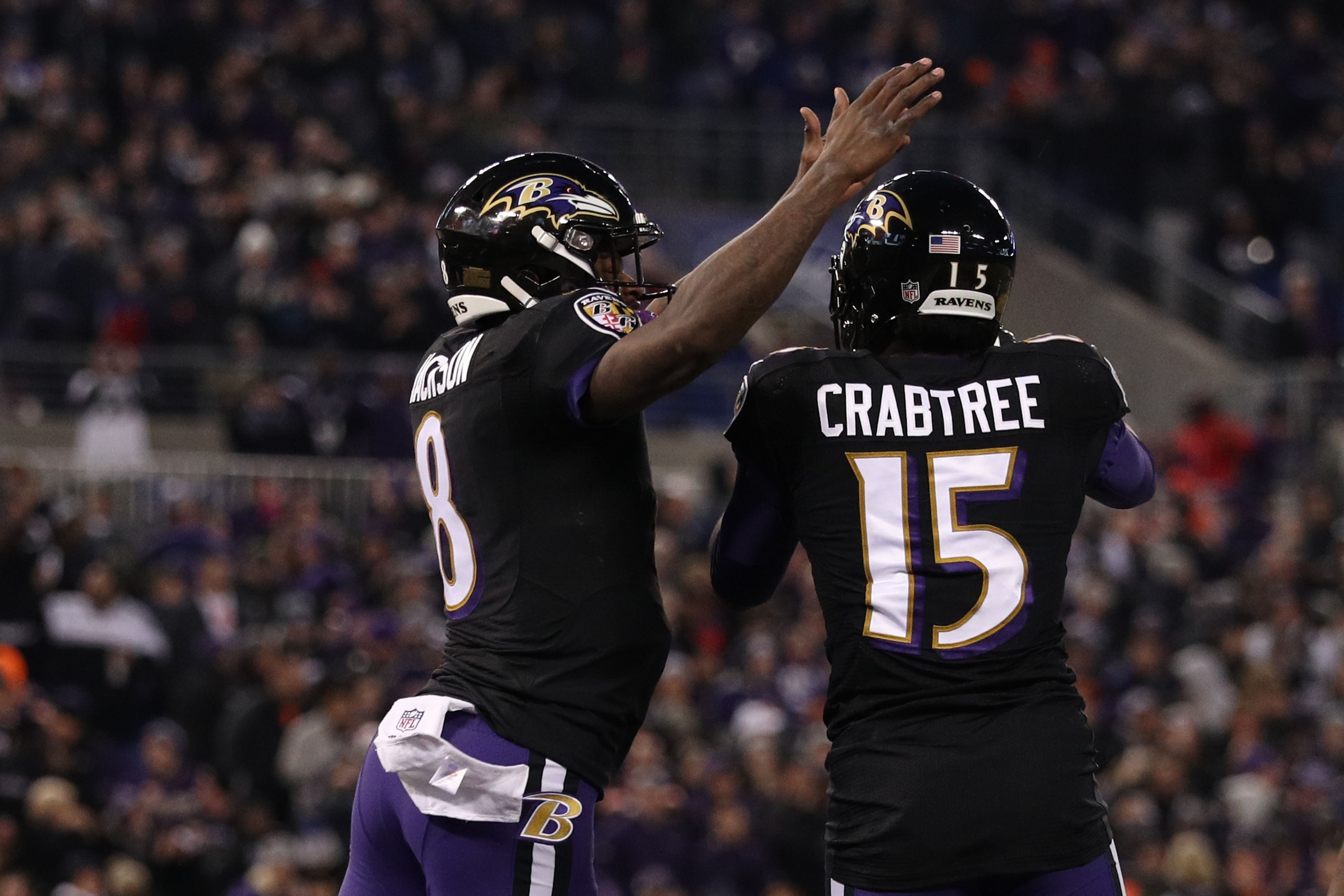 BALTIMORE, MARYLAND - DECEMBER 30: Quarterback Lamar Jackson #8 of the Baltimore Ravens and wide receiver Michael Crabtree #15 celebrate after a touchdown in the second quarter against the Cleveland Browns at M&T Bank Stadium on December 30, 2018 in Balti