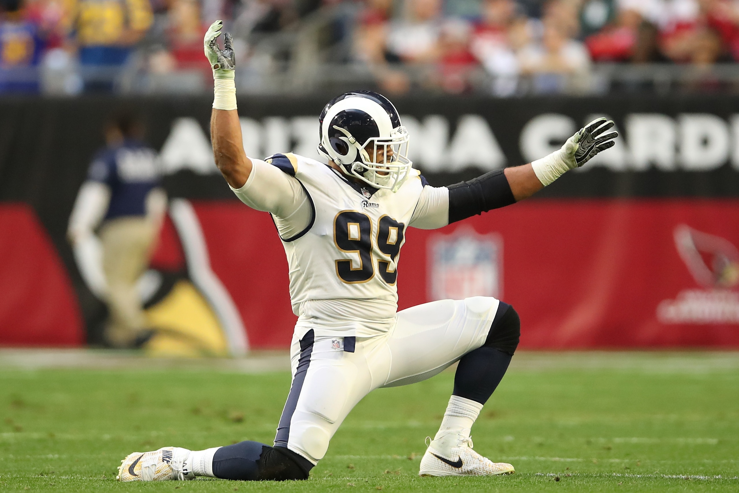 GLENDALE, ARIZONA - DECEMBER 23: Aaron Donald #99 of the Los Angeles Rams celebrates a sack in the second half of the NFL game against the Arizona Cardinals at State Farm Stadium on December 23, 2018 in Glendale, Arizona. (Photo by Christian Petersen/Gett