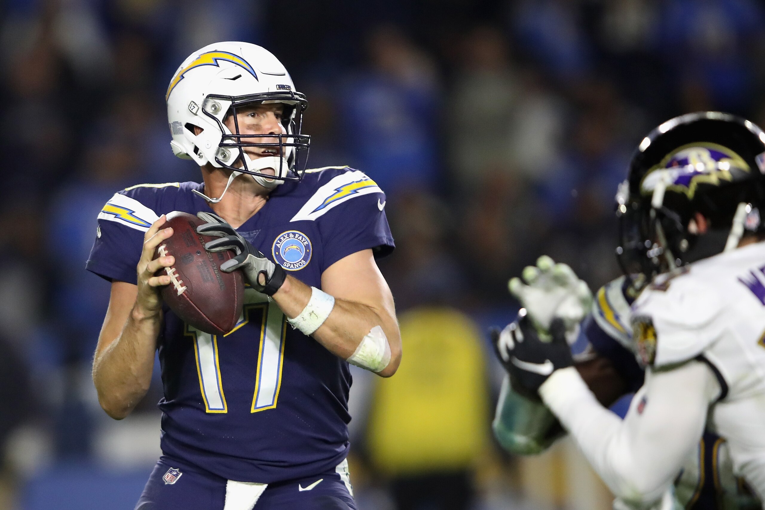 CARSON, CA - DECEMBER 22:  Philip Rivers #17 of the Los Angeles Chargers passes the ball under pressure in the pocket during the second half of a game against the Baltimore Ravens at StubHub Center on December 22, 2018 in Carson, California.  (Photo by Se
