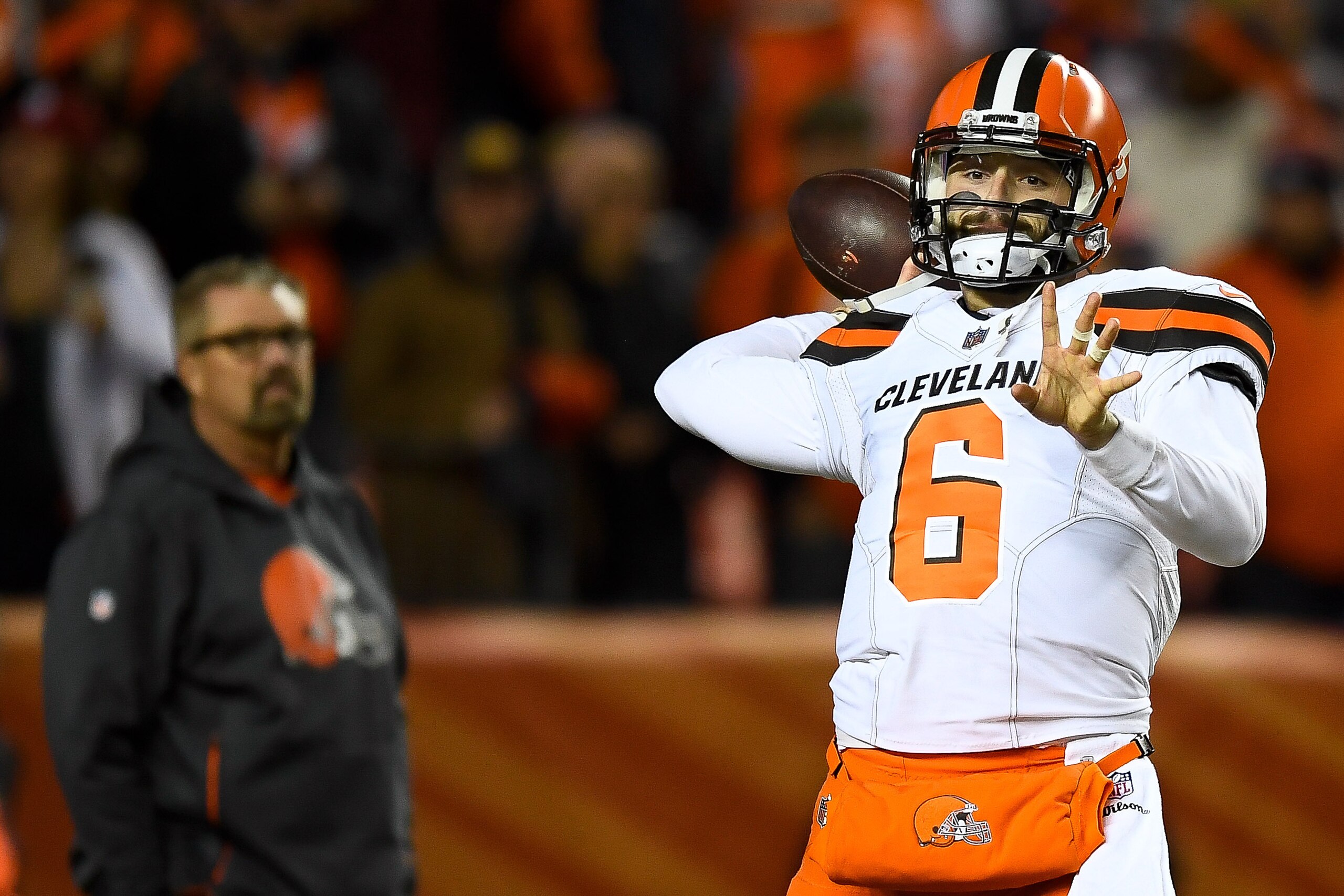 DENVER, CO - DECEMBER 15:  Quarterback Baker Mayfield #6 of the Cleveland Browns warms up as head coach Gregg Williams of the Cleveland Browns looks on before a game against the Denver Broncos at Broncos Stadium at Mile High on December 15, 2018 in Denver