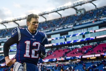 FOXBOROUGH, MASSACHUSETTS - DECEMBER 30: Tom Brady #12 of the New England Patriots runs off the field after a game against the New York Jets at Gillette Stadium on December 30, 2018 in Foxborough, Massachusetts. (Photo by Billie Weiss/Getty Images)