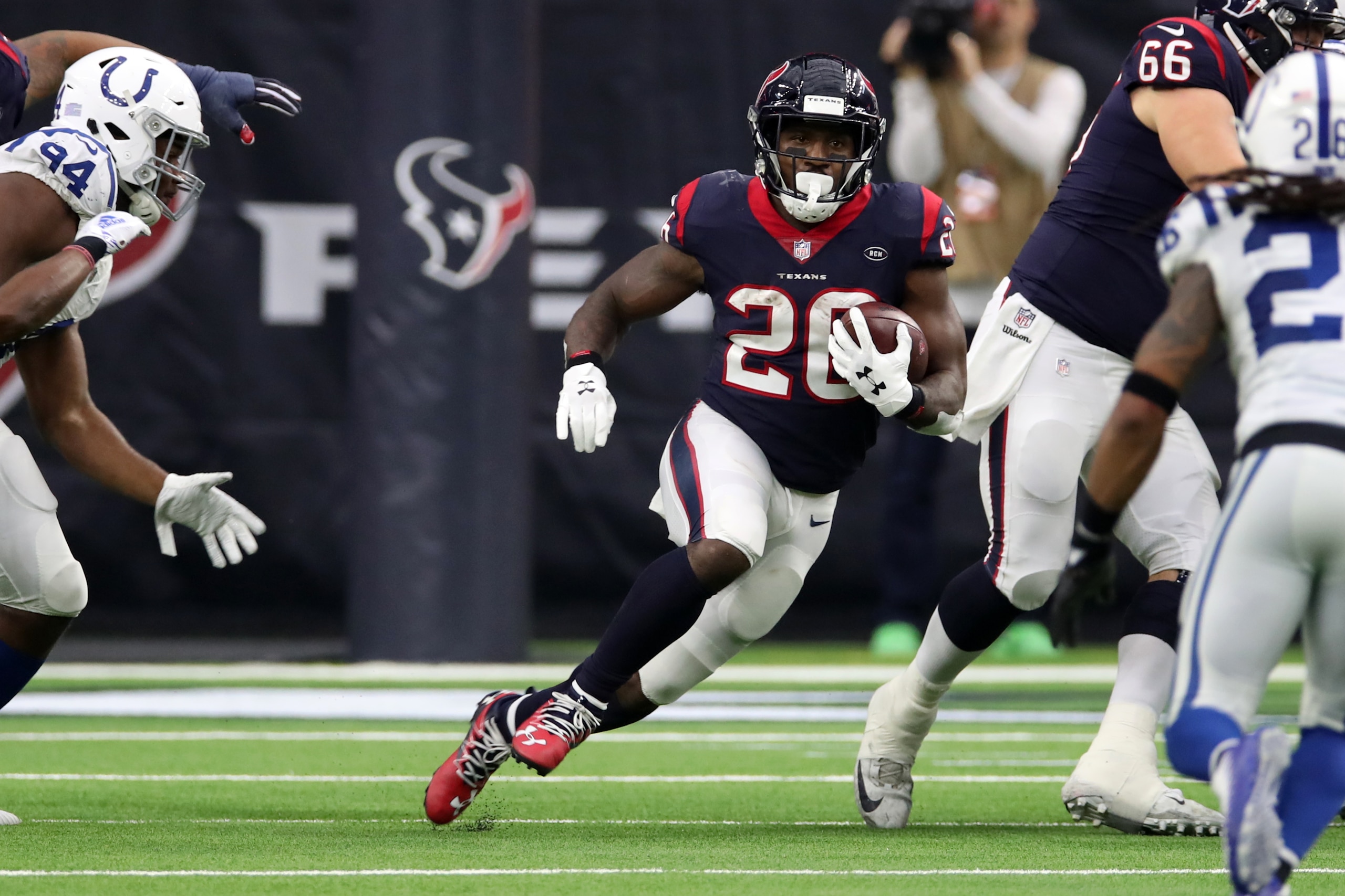 HOUSTON, TX - DECEMBER 09:  Lamar Miller #26 of the Houston Texans runs with the ball during the game against the Indianapolis Colts at NRG Stadium on December 9, 2018 in Houston, Texas. The Colts defeated the Texans 24-21.  (Photo by Rob Leiter via Getty