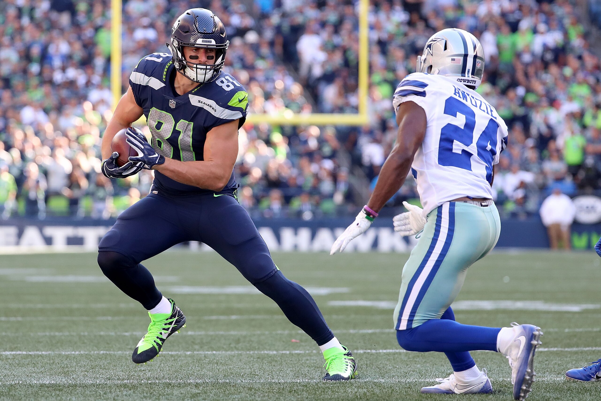 SEATTLE, WA - SEPTEMBER 23:  Nick Vannett #81 of the Seattle Seahawks works against Chidobe Awuzie #24 of the Dallas Cowboys in the fourth quarter during their game at CenturyLink Field on September 23, 2018 in Seattle, Washington.  (Photo by Abbie Parr/G