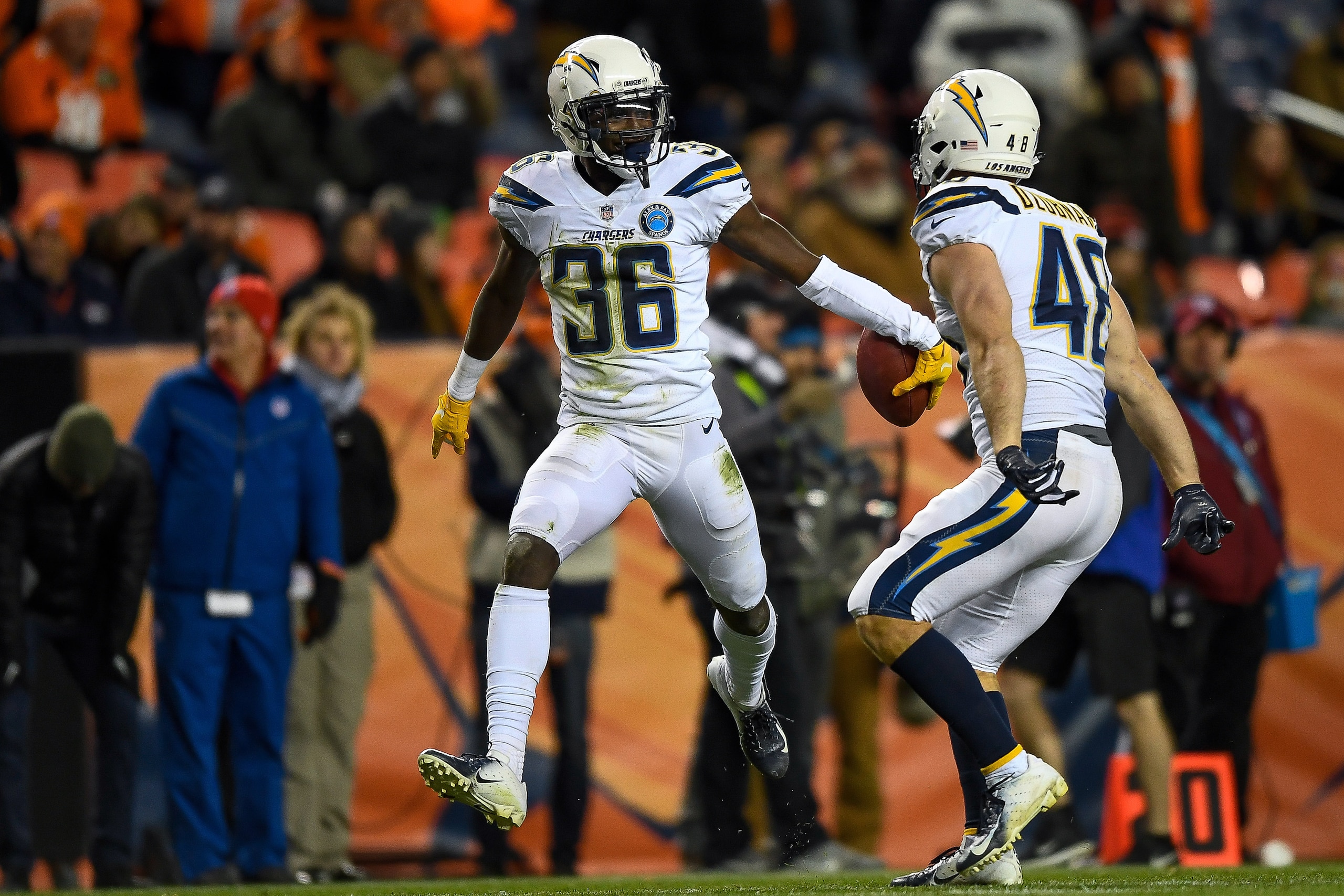 DENVER, CO - DECEMBER 30:  Defensive back Brandon Facyson #36 of the Los Angeles Chargers celebrates after aq fumble recovery against the Denver Broncos in the fourth quarter of a game at Broncos Stadium at Mile High on December 30, 2018 in Denver, Colora