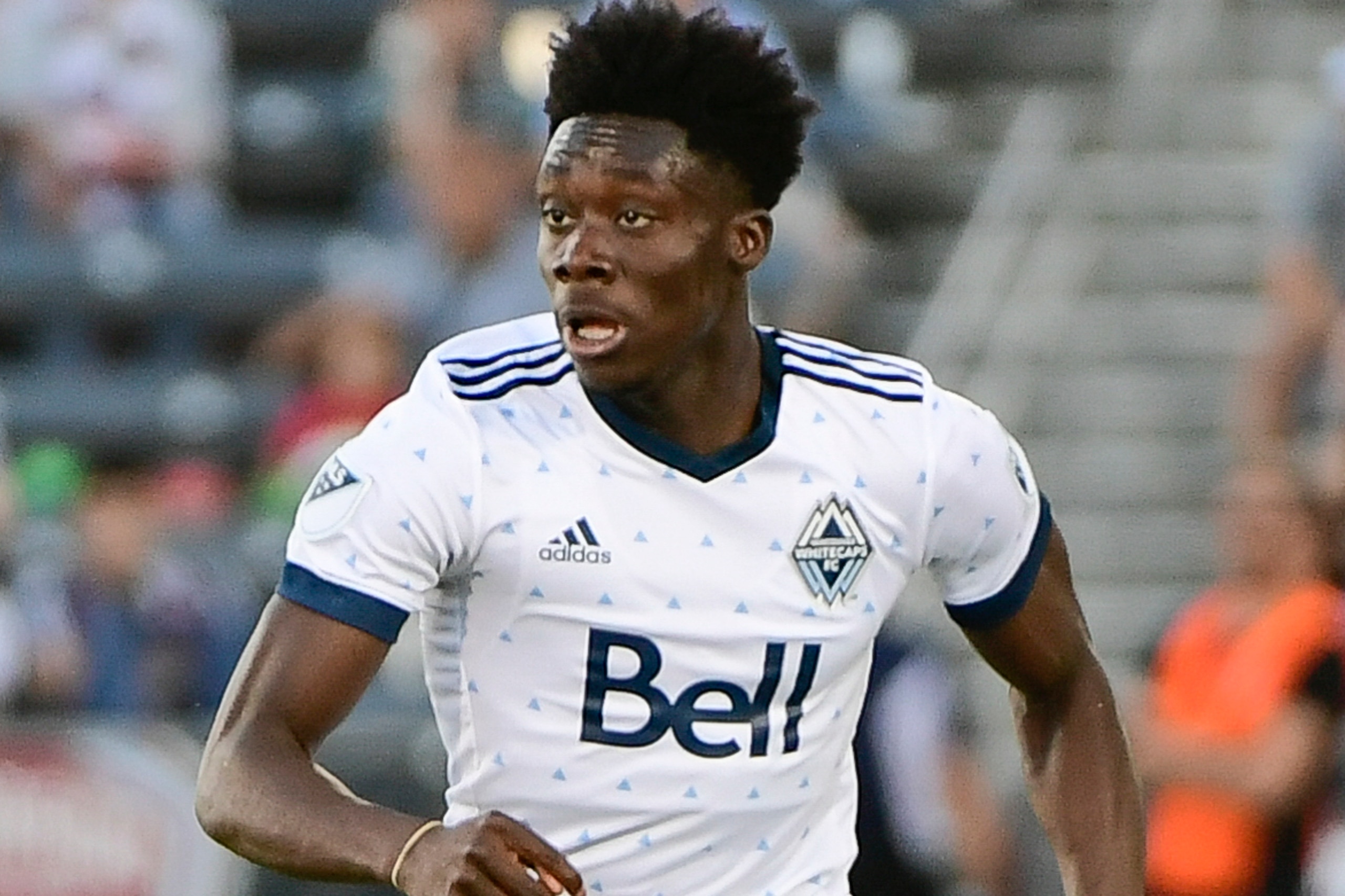 COMMERCE CITY, CO - JUNE 01: Alphonso Davies #67 of Vancouver Whitecaps dribbles upfield against the Colorado Rapids at Dick's Sporting Goods Park on June 1, 2018 in Commerce City, Colorado. (Photo by Timothy Nwachukwu/Getty Images) COMMERCE CITY, CO - JUNE 01: Alphonso Davies #67 of Vancouver Whitecaps dribbles upfield against the Colorado Rapids at Dick's Sporting Goods Park on June 1, 2018 in Commerce City, Colorado. (Photo by Timothy Nwachukwu/Getty Images)