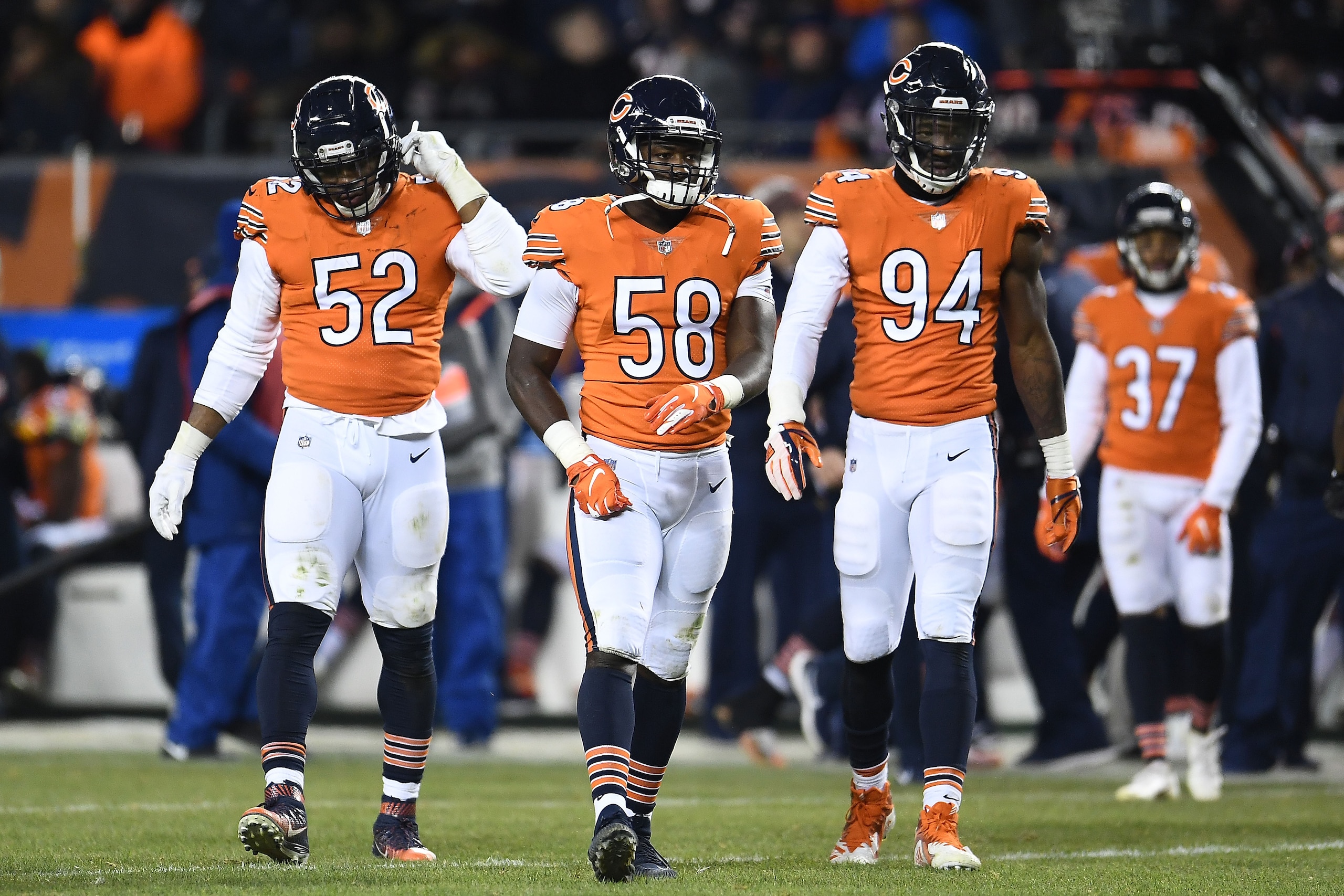 CHICAGO, ILLINOIS - NOVEMBER 18:  Khalil Mack #52, Roquan Smith #58 and Leonard Floyd #94 of the Chicago Bears take the field during a game against the Minnesota Vikings at Soldier Field on November 18, 2018 in Chicago, Illinois.  The Bears defeated the V