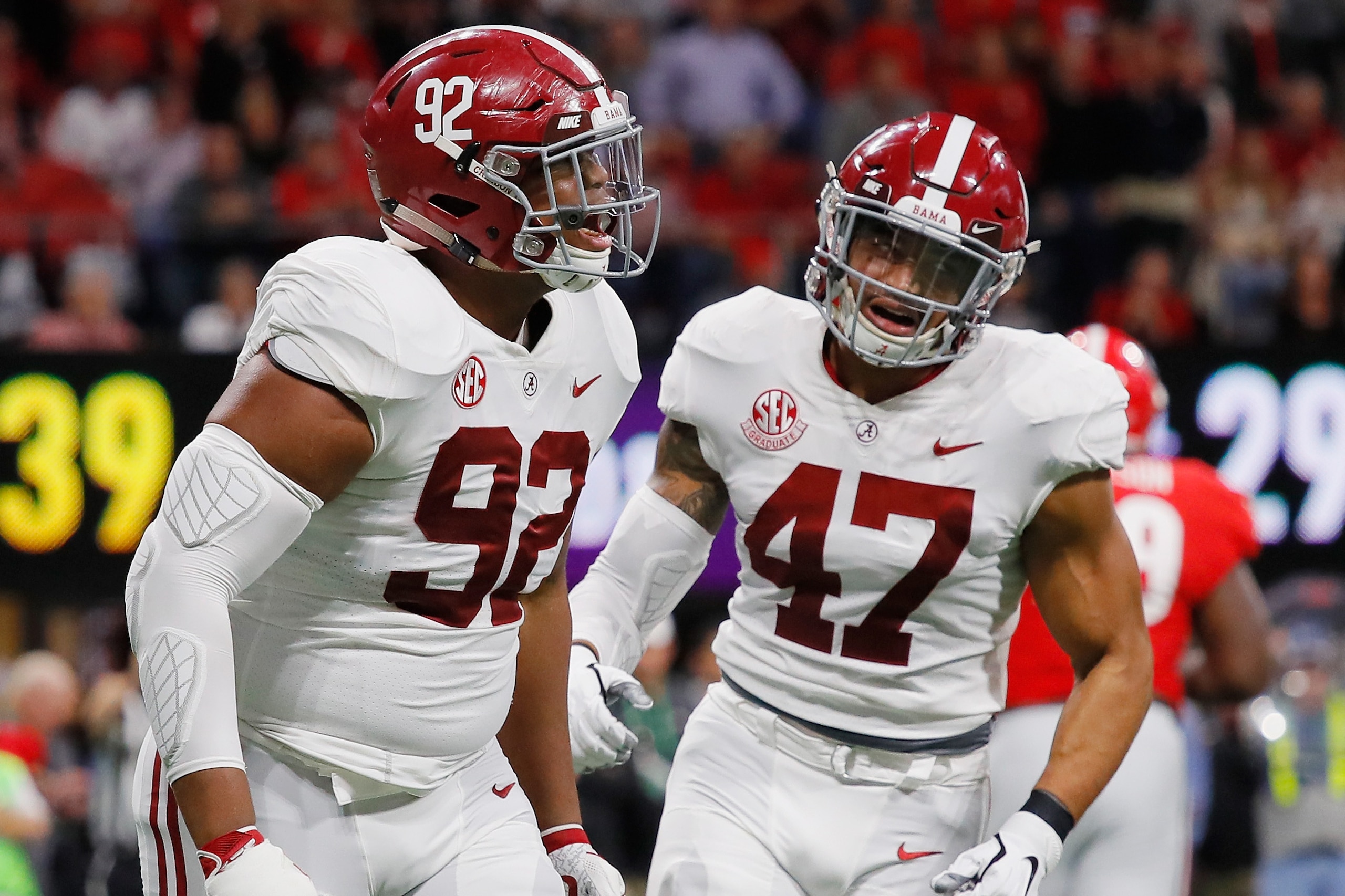 ATLANTA, GA - DECEMBER 01: Quinnen Williams #92 of the Alabama Crimson Tide reacts with Christian Miller #47 after sacking Jake Fromm #11 of the Georgia Bulldogs (not pictured) in the first half during the 2018 SEC Championship Game at Mercedes-Benz Stad ATLANTA, GA - DECEMBER 01: Quinnen Williams #92 of the Alabama Crimson Tide reacts with Christian Miller #47 after sacking Jake Fromm #11 of the Georgia Bulldogs (not pictured) in the first half during the 2018 SEC Championship Game at Mercedes-Benz Stad
