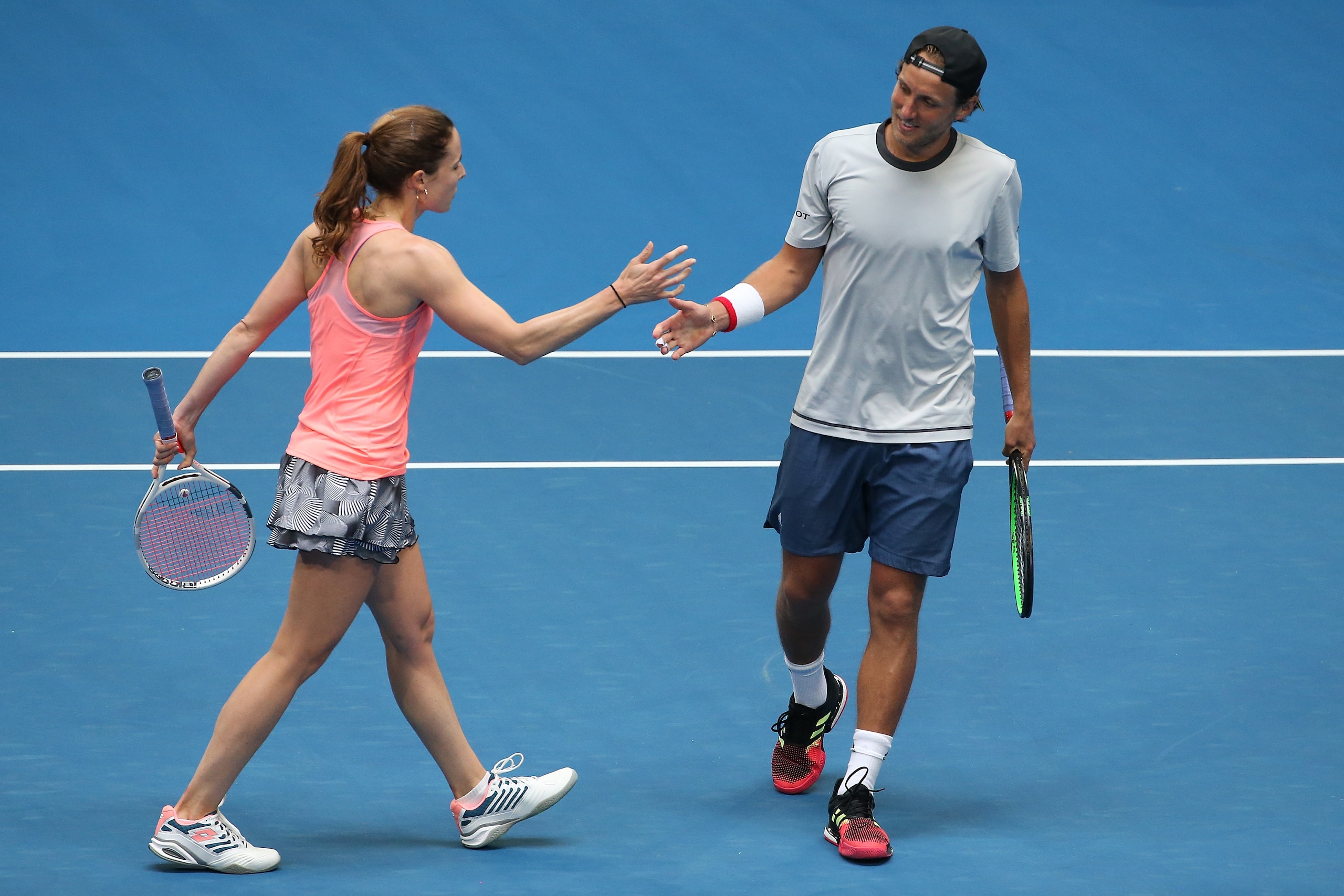 PERTH, AUSTRALIA - JANUARY 02: Alize Cornet and Lucas Pouille of France celebrate winning a point in he mixed doubles match against Angelique Kerber and Alexander Zverev of Germany during day five of the 2019 Hopman Cup at RAC Arena on January 02, 2019 in