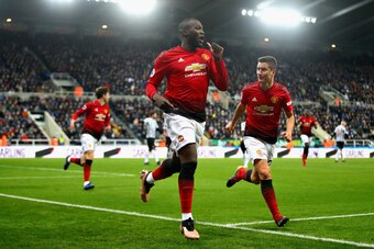 NEWCASTLE UPON TYNE, ENGLAND - JANUARY 02:  Romelu Lukaku of Manchester United celebrates with teammate Ander Herrera after scoring his sides first goal during the Premier League match between Newcastle United and Manchester United at St. James Park on Ja