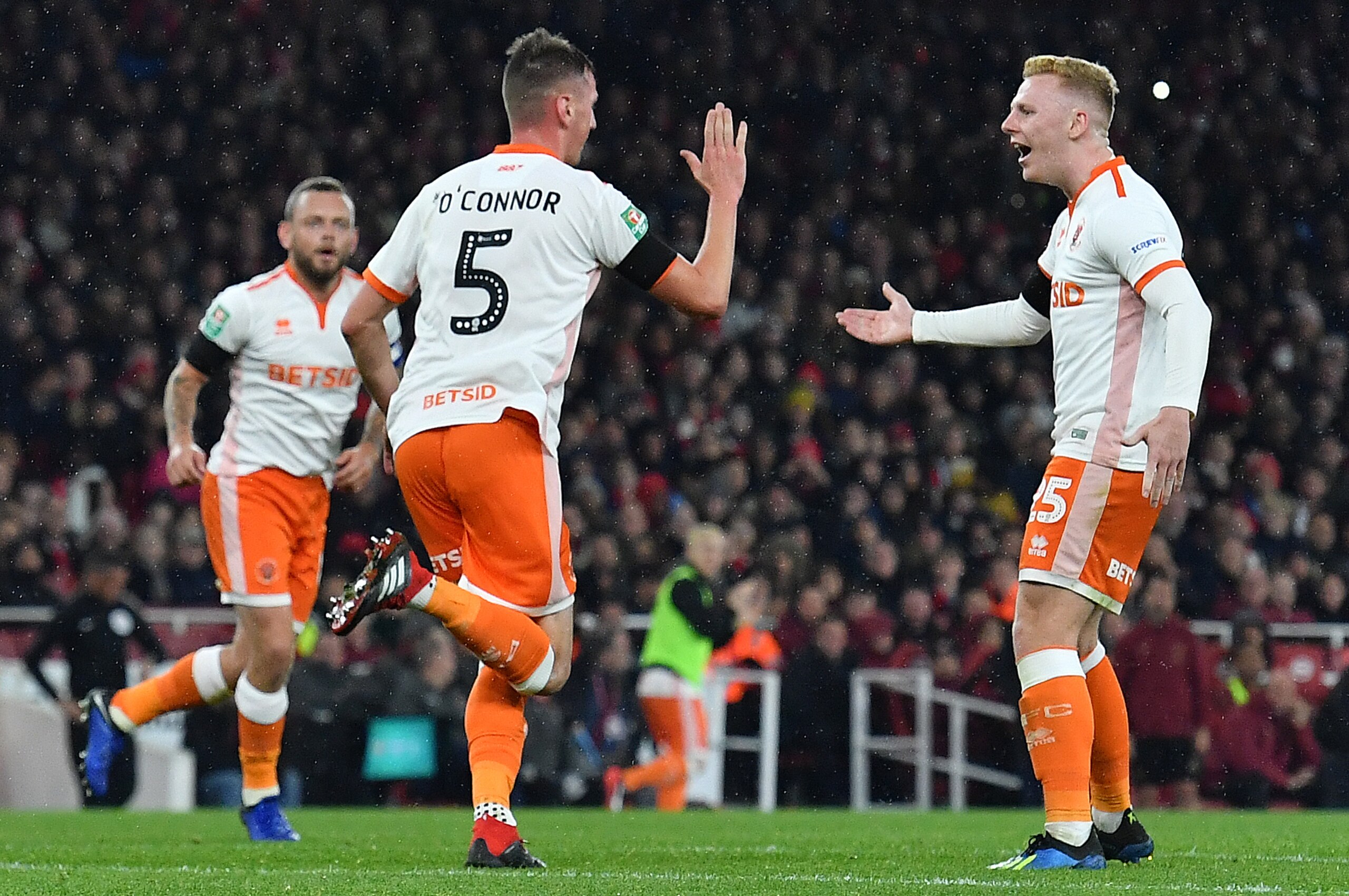 Blackpool's Irish midfielder Paudie O'Connor (C) celebrates scoring his team's first goal during the English League Cup football match between West Ham United and Tottenham Hotspur at The London Stadium, in east London on October 31, 2018. (Photo by Ben S