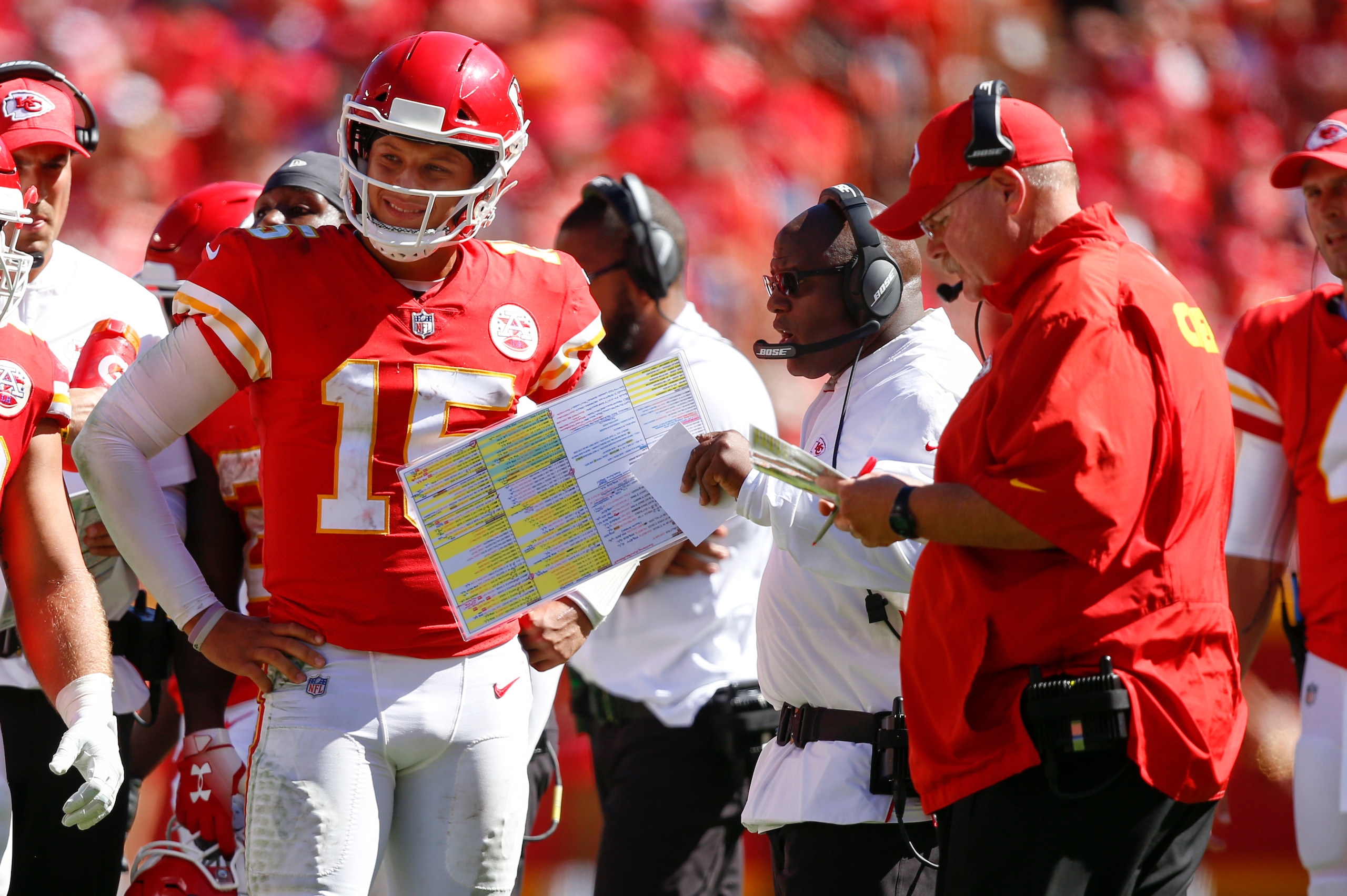 KANSAS CITY, MO - SEPTEMBER 23: Patrick Mahomes #15 of the Kansas City Chiefs and teammate Anthony Sherman #42 stand with head coach Andy Reid and offensive coordinator Eric Bieniemy in the fourth quarter of the game against the San Francisco 49ers at Arr KANSAS CITY, MO - SEPTEMBER 23: Patrick Mahomes #15 of the Kansas City Chiefs and teammate Anthony Sherman #42 stand with head coach Andy Reid and offensive coordinator Eric Bieniemy in the fourth quarter of the game against the San Francisco 49ers at Arr
