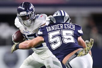 ARLINGTON, TX - NOVEMBER 05:  Dion Lewis #33 of the Tennessee Titans tries to hold off Leighton Vander Esch #55 of the Dallas Cowboys on a run in he fourth quarter of a football game at AT&T Stadium on November 5, 2018 in Arlington, Texas.  (Photo by Tom 