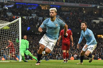 Manchester City's Argentinian striker Sergio Aguero (C) celebrates after scoring the opening goal of the English Premier League football match between Manchester City and Liverpool at the Etihad Stadium in Manchester, north west England, on January 3, 201
