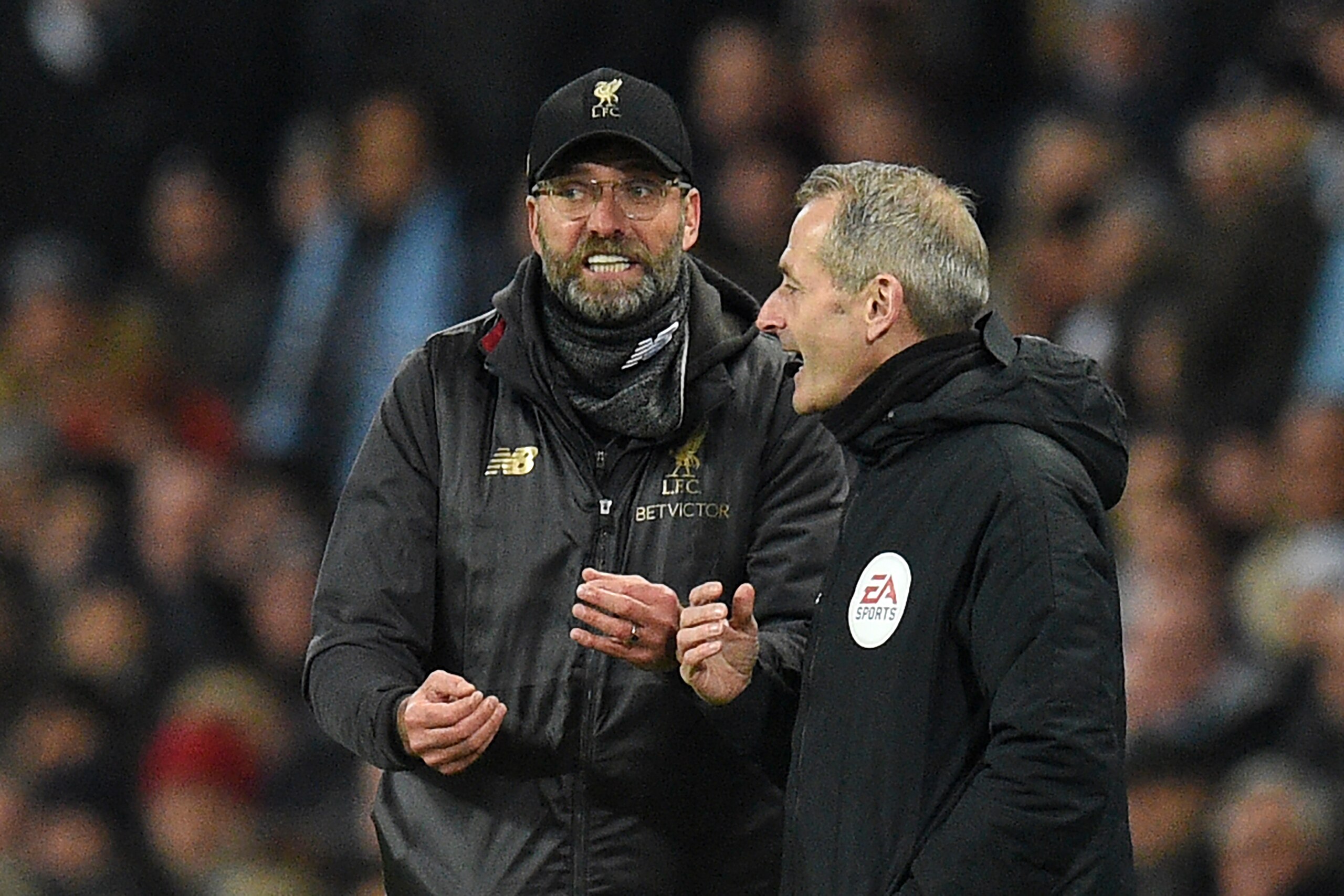 Liverpool's German manager Jurgen Klopp (L) talks with fourth official Martin Atkinson (R) during the English Premier League football match between Manchester City and Liverpool at the Etihad Stadium in Manchester, north west England, on January 3, 2019. Liverpool's German manager Jurgen Klopp (L) talks with fourth official Martin Atkinson (R) during the English Premier League football match between Manchester City and Liverpool at the Etihad Stadium in Manchester, north west England, on January 3, 2019.