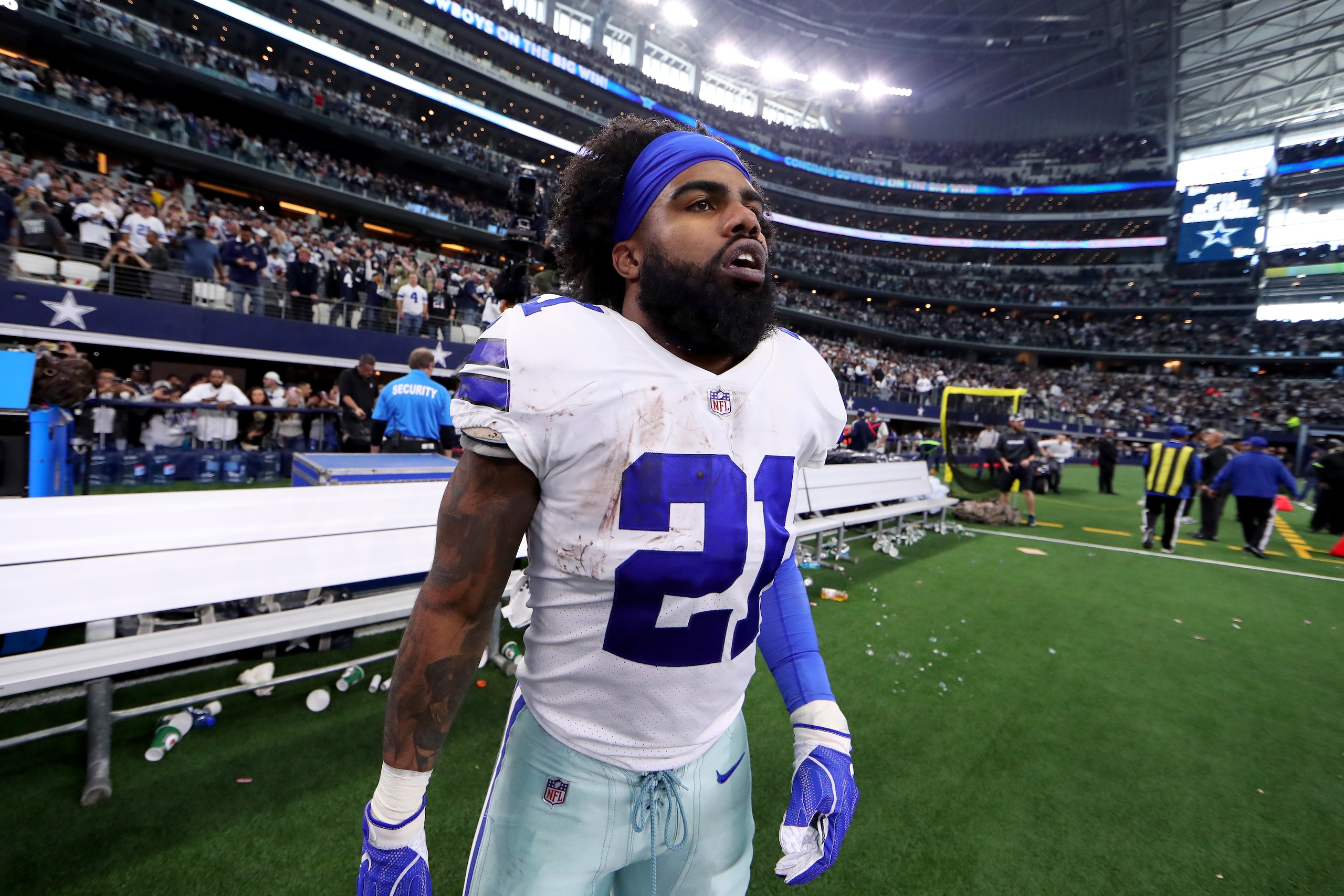 ARLINGTON, TEXAS - DECEMBER 23: Ezekiel Elliott #21 of the Dallas Cowboys walks off the field after the Dallas Cowboys beat the Tampa Bay Buccaneers 27-20 at AT&T Stadium on December 23, 2018 in Arlington, Texas. (Photo by Tom Pennington/Getty Images)
