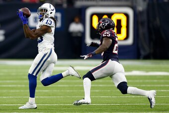 HOUSTON, TX - DECEMBER 09:  T.Y. Hilton #13 of the Indianapolis Colts catches a pass as he slips behind Kareem Jackson #25 of the Houston Texans during the fourth quarter at NRG Stadium on December 9, 2018 in Houston, Texas.  (Photo by Bob Levey/Getty Ima