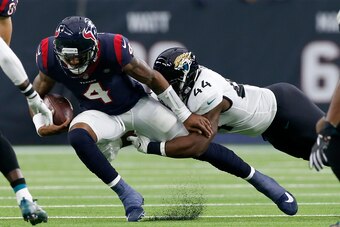HOUSTON, TX - DECEMBER 30:  Deshaun Watson #4 of the Houston Texans is tackled by Myles Jack #44 of the Jacksonville Jaguars in the first quarter at NRG Stadium on December 30, 2018 in Houston, Texas.  (Photo by Tim Warner/Getty Images)