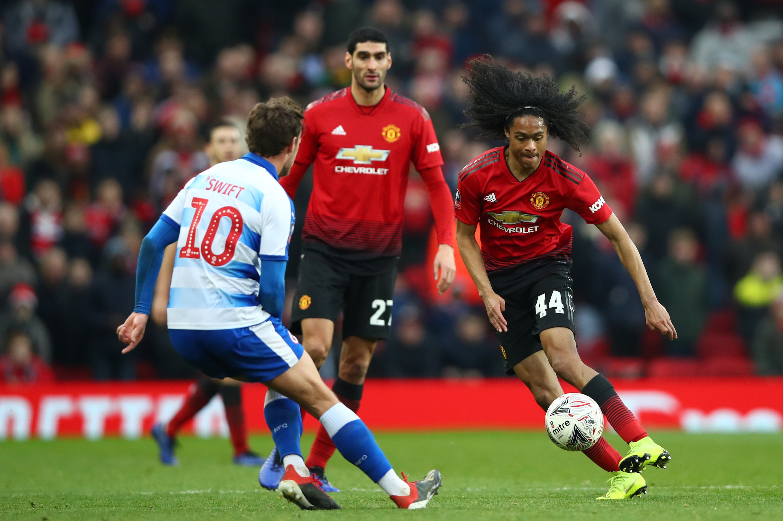MANCHESTER, ENGLAND - JANUARY 05:  Tahith Chong of Manchester United battles for possession with John Swift of Reading during the FA Cup Third Round match between Manchester United and Reading at Old Trafford on January 5, 2019 in Manchester, United Kingd
