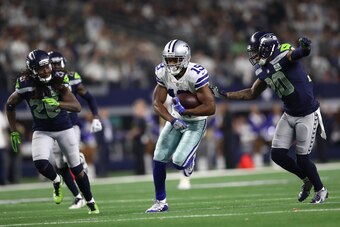 ARLINGTON, TEXAS - JANUARY 05:   Amari Cooper #19 of the Dallas Cowboys runs the ball against Bradley McDougald #30 of the Seattle Seahawks in the Wild Card Round at AT&T Stadium on January 05, 2019 in Arlington, Texas. (Photo by Ronald Martinez/Getty Ima