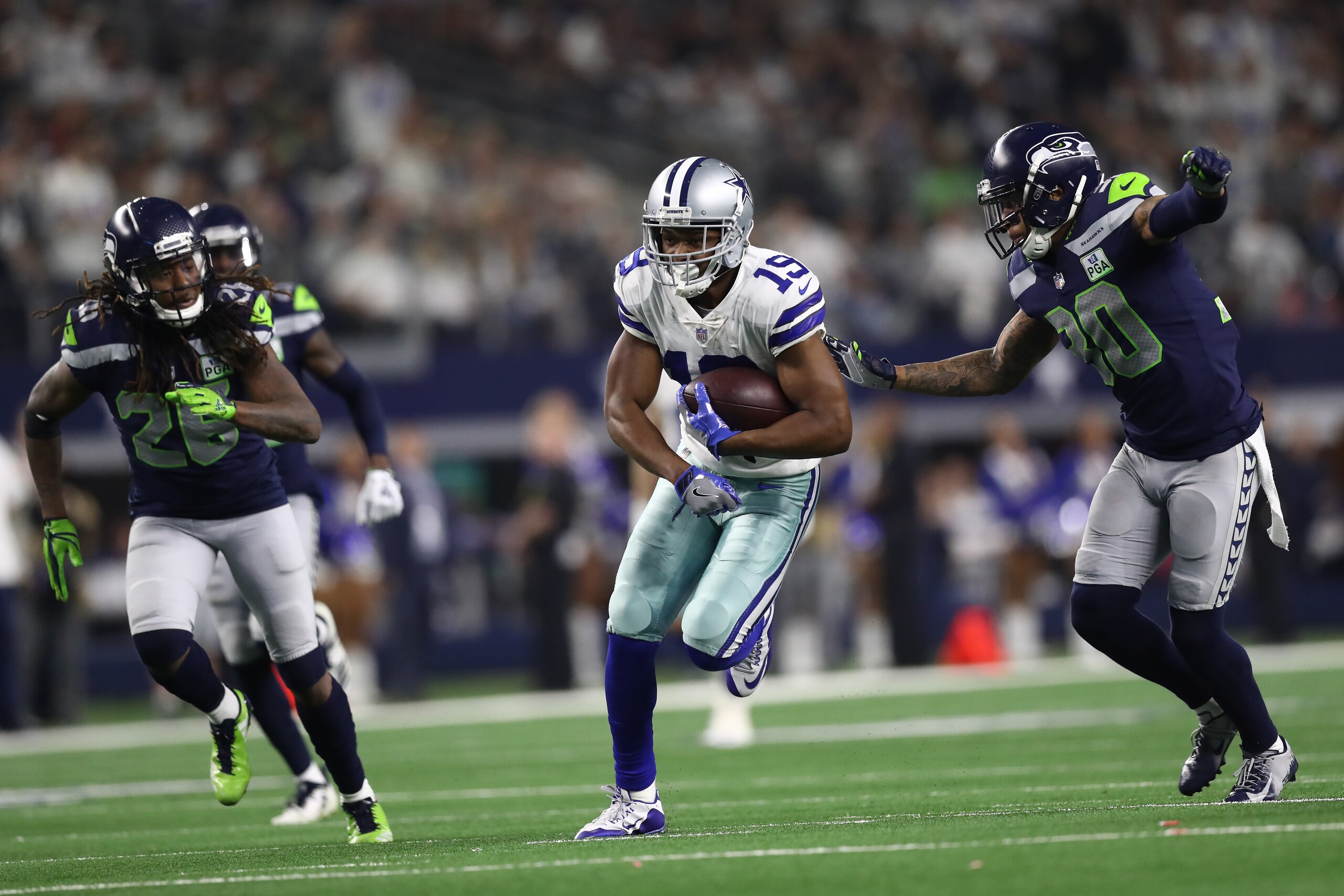 ARLINGTON, TEXAS - JANUARY 05: Amari Cooper #19 of the Dallas Cowboys runs the ball against Bradley McDougald #30 of the Seattle Seahawks in the Wild Card Round at AT&T Stadium on January 05, 2019 in Arlington, Texas. (Photo by Ronald Martinez/Getty Ima ARLINGTON, TEXAS - JANUARY 05: Amari Cooper #19 of the Dallas Cowboys runs the ball against Bradley McDougald #30 of the Seattle Seahawks in the Wild Card Round at AT&T Stadium on January 05, 2019 in Arlington, Texas. (Photo by Ronald Martinez/Getty Ima