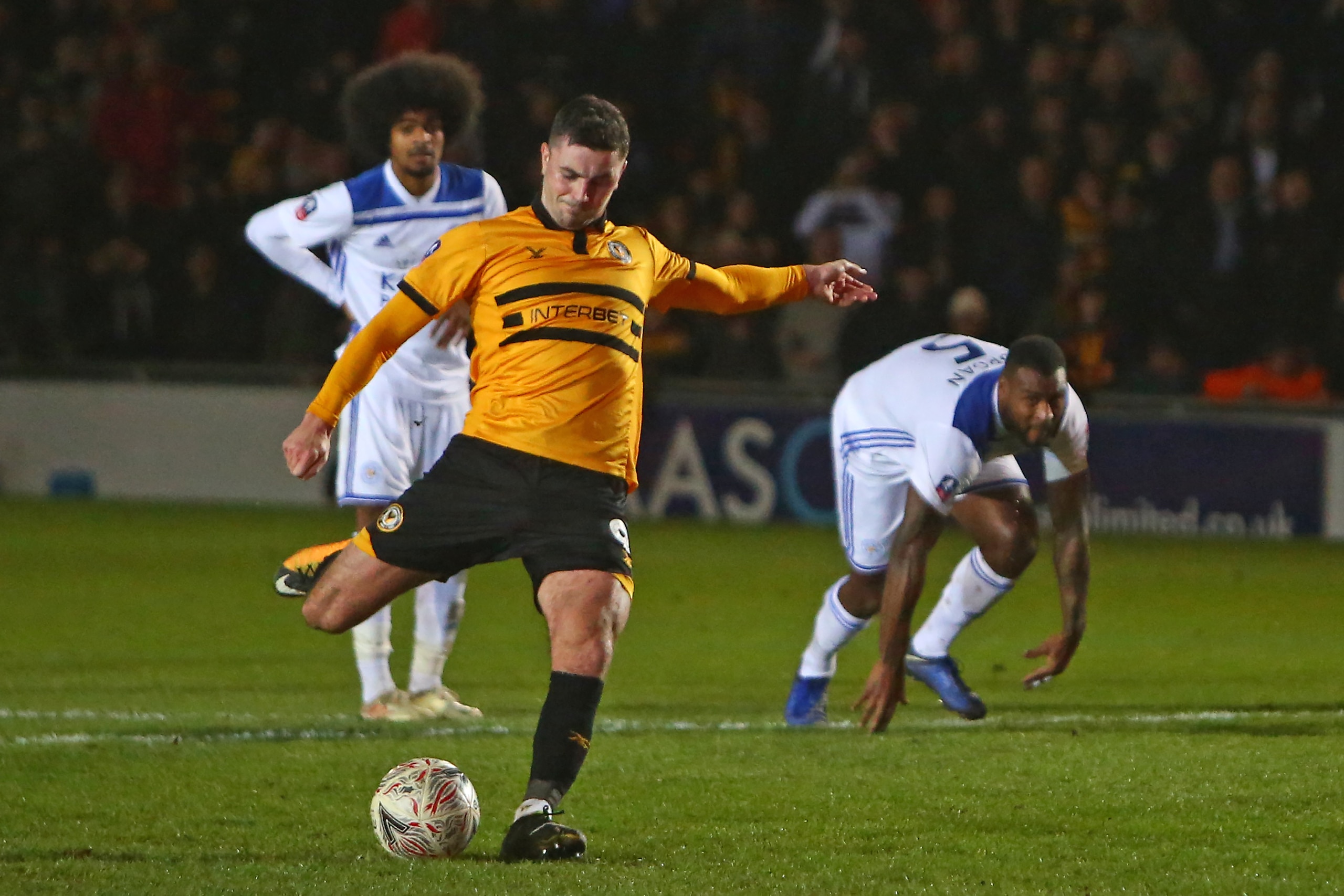 Newport County's Irish striker Padraig Amond scores their second goal from the penalty spot during the English FA Cup third round football match between Newport County and Leicester City at Rodney Parade in Newport, south Wales on January 6, 2019. (Photo 