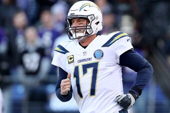 BALTIMORE, MARYLAND - JANUARY 06: Philip Rivers #17 of the Los Angeles Chargers celebrates after throwing a two point conversion to Mike Williams #81 against the Baltimore Ravens during the fourth quarter in the AFC Wild Card Playoff game at M&T Bank Stad