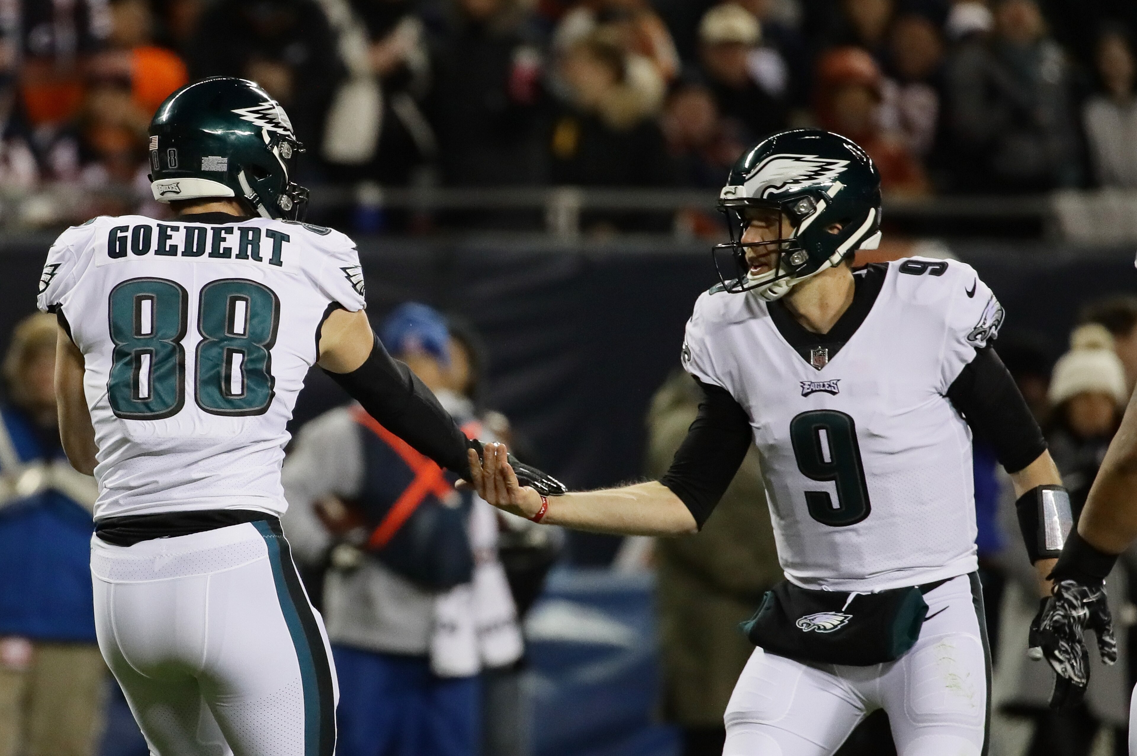 CHICAGO, ILLINOIS - JANUARY 06:  Dallas Goedert #88 and Nick Foles #9 of the Philadelphia Eagles celebrate a touchdown against the Chicago Bears in the third quarter of the NFC Wild Card Playoff game at Soldier Field on January 06, 2019 in Chicago, Illino