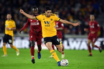 WOLVERHAMPTON, ENGLAND - JANUARY 07: Raul Jimenez of Wolverhampton Wanderers avoids Naby Keita of Liverpool during the Emirates FA Cup Third Round match between Wolverhampton Wanderers and Liverpool at Molineux on January 7, 2019 in Wolverhampton, United 