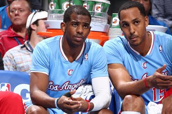 OKLAHOMA CITY, OK - FEBRUARY 23: Chris Paul #3 of the Los Angeles Clippers and Ryan Hollins #15 of the Los Angeles Clippers react during a game at Chesapeake Energy Arena on February 23, 2014 in Oklahoma City, Oklahoma. NOTE TO USER: User expressly acknow
