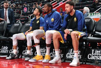 DETROIT, MI - DECEMBER 1: Stephen Curry #30, Kevin Durant #35, and Klay Thompson #11 of the Golden State Warriors look on before the game against the Detroit Pistons on December 1, 2018 at Little Caesars Arena in Detroit, Michigan. NOTE TO USER: User expr