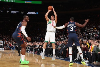 NEW YORK, NY - DECEMBER 25: Brook Lopez #11 of the Milwaukee Bucks shoots a three pointer during the game against Noah Vonleh #32 of the New York Knicks on Decemeber 25, 2018 at Madison Square Garden in New York City, New York.  NOTE TO USER: User express