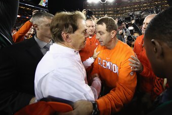 SANTA CLARA, CA - JANUARY 07:  Head coach Dabo Swinney of the Clemson Tigers meets head coach Nick Saban of the Alabama Crimson Tide at mid-field after his 44-16 win in the CFP National Championship presented by AT&T at Levi's Stadium on January 7, 2019 i