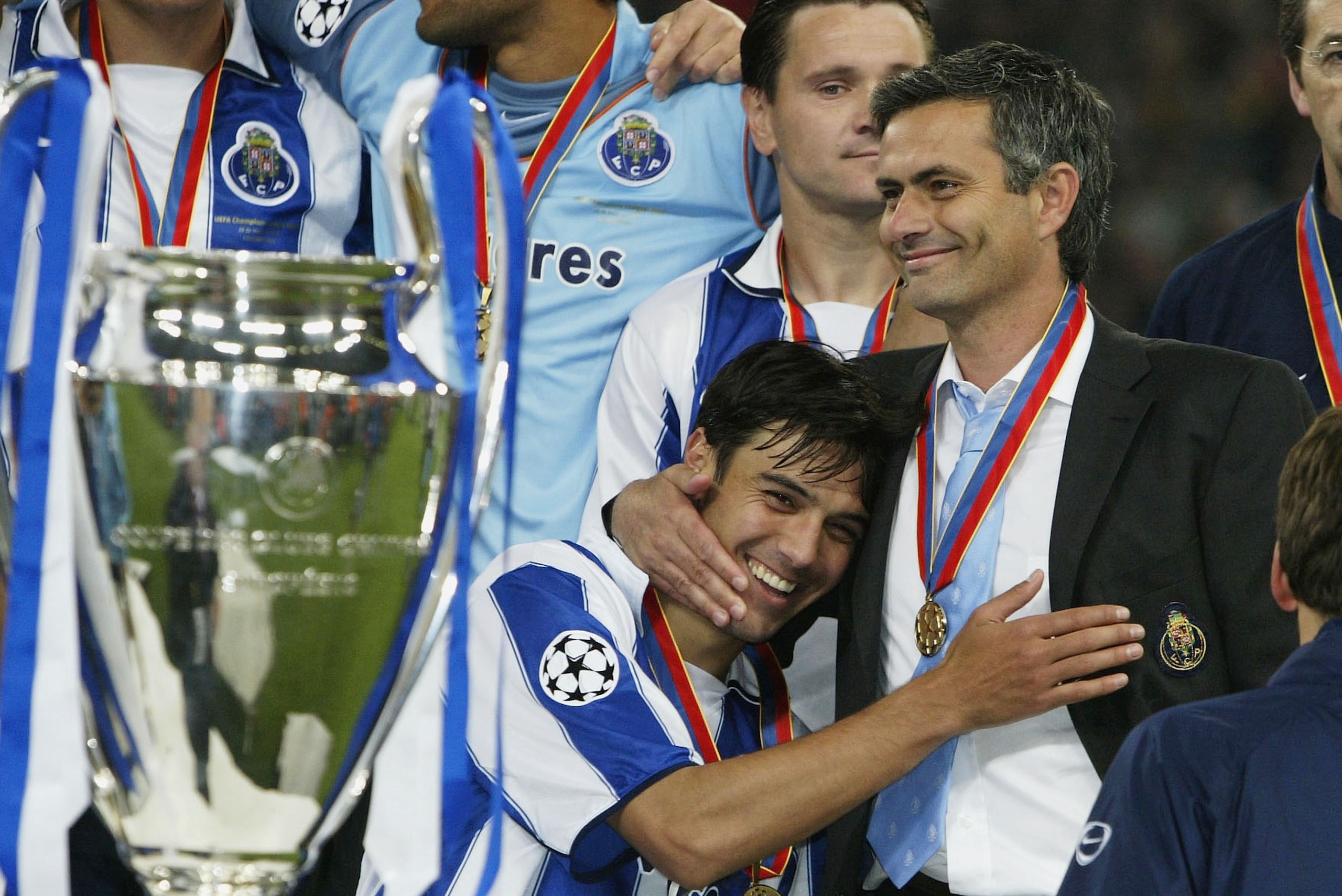 GELSENKIRCHEN, GERMANY - MAY 26:  Nuno Valente of FC Porto hugs his manager Jose Dos Santos Mourinho after winning the Champions League during the UEFA Champions League Final match between AS Monaco and FC Porto at the AufSchake Arena on May 26, 2004 in G