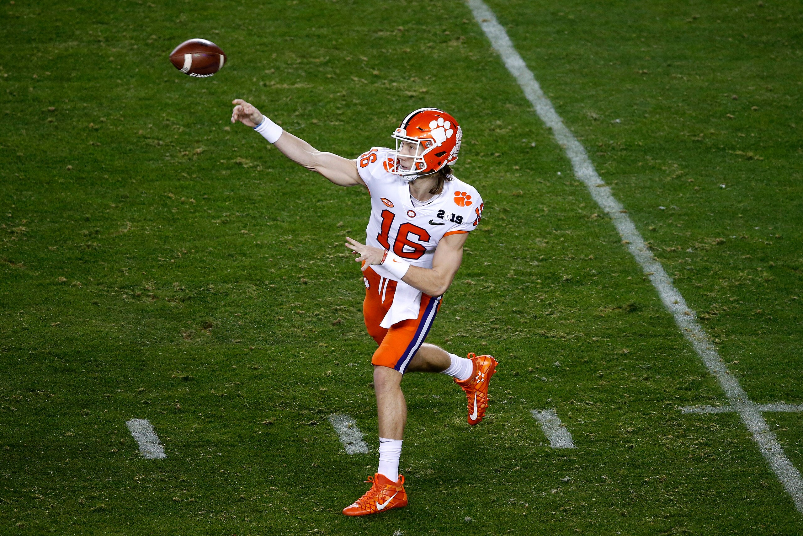 SANTA CLARA, CALIFORNIA - JANUARY 07: Trevor Lawrence #16 of the Clemson Tigers throws a pass against the Alabama Crimson Tide during the first quarter in the College Football Playoff National Championship at Levi's Stadium on January 07, 2019 in Santa Cl